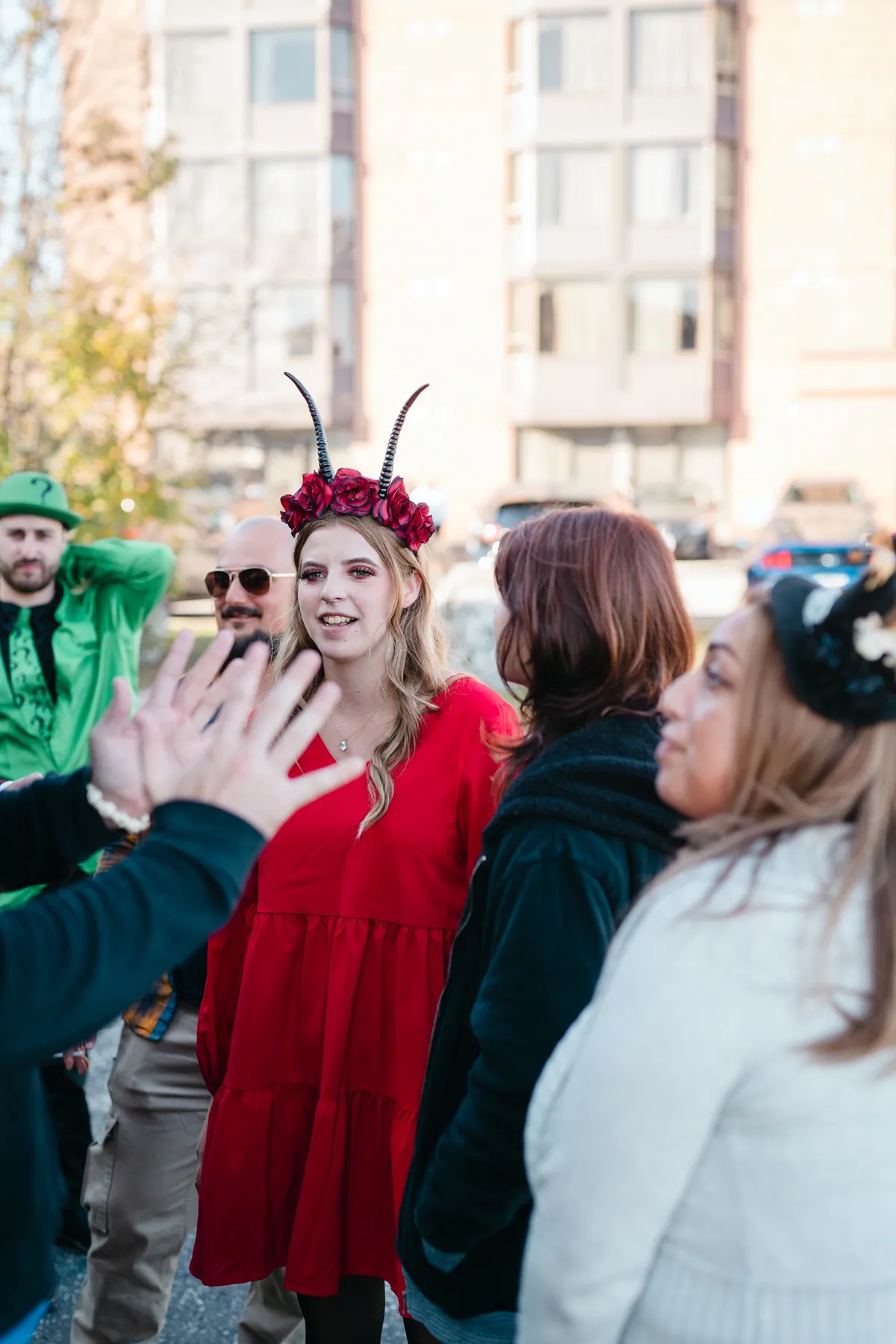 Costumed guests socializing at Jenna and Jake’s Halloween party.