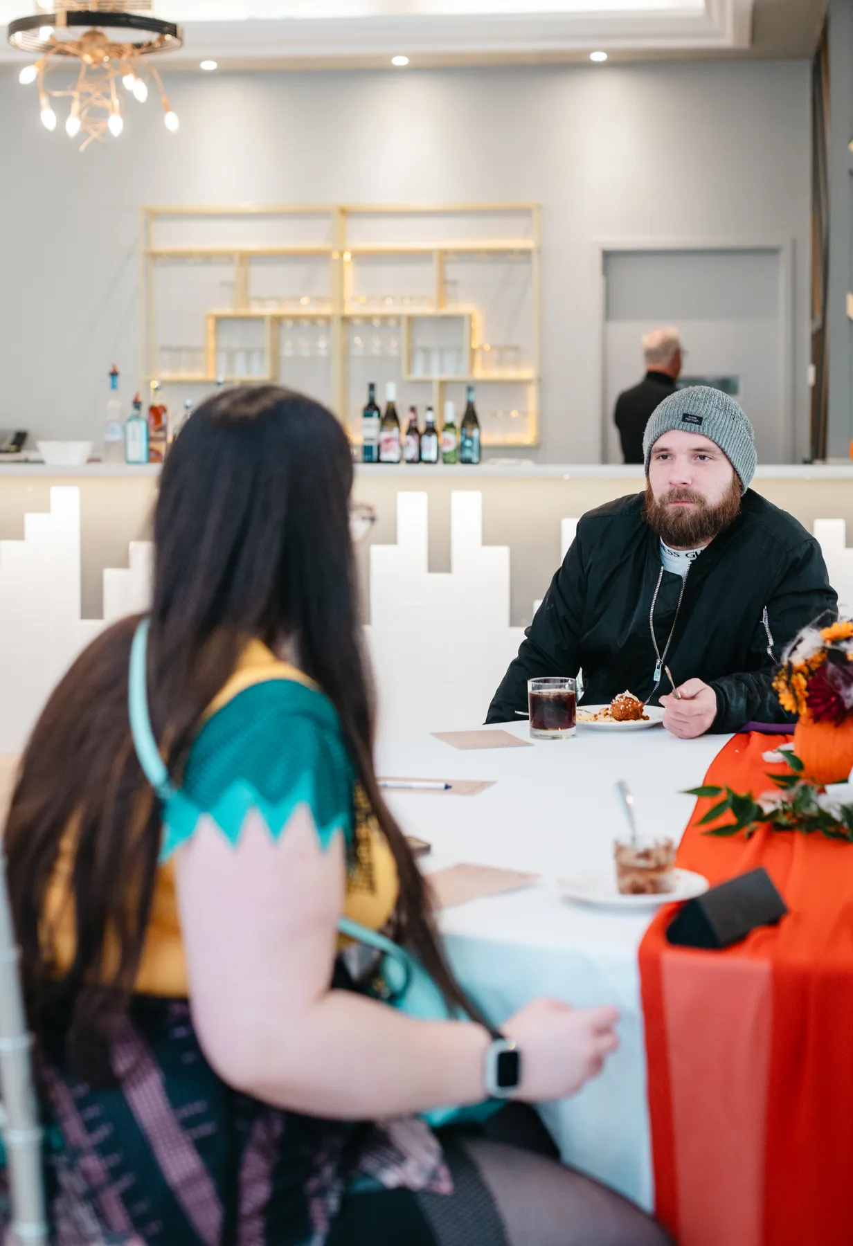 Guests chatting at party tables at Jenna and Jake’s Halloween party.