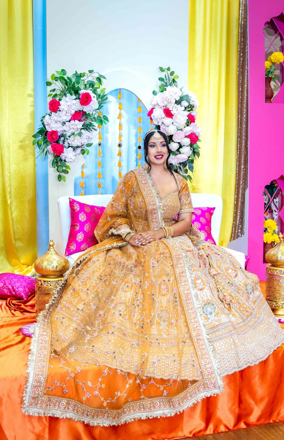 Portraits and outfit details of a woman in gold at Jessie and Erin’s Haldi celebration.