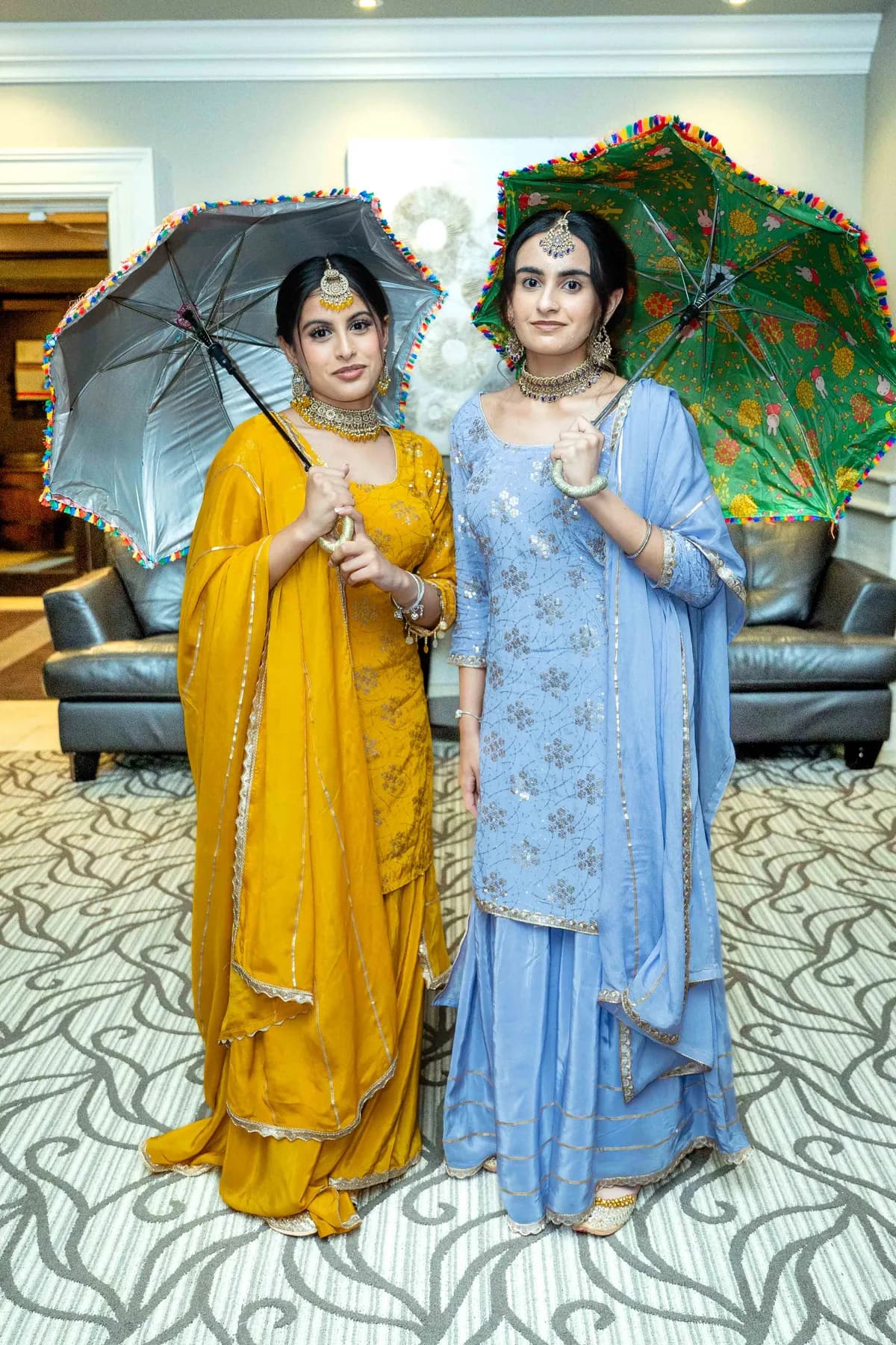 Two women posing together at Jessie and Erin’s Haldi celebration.