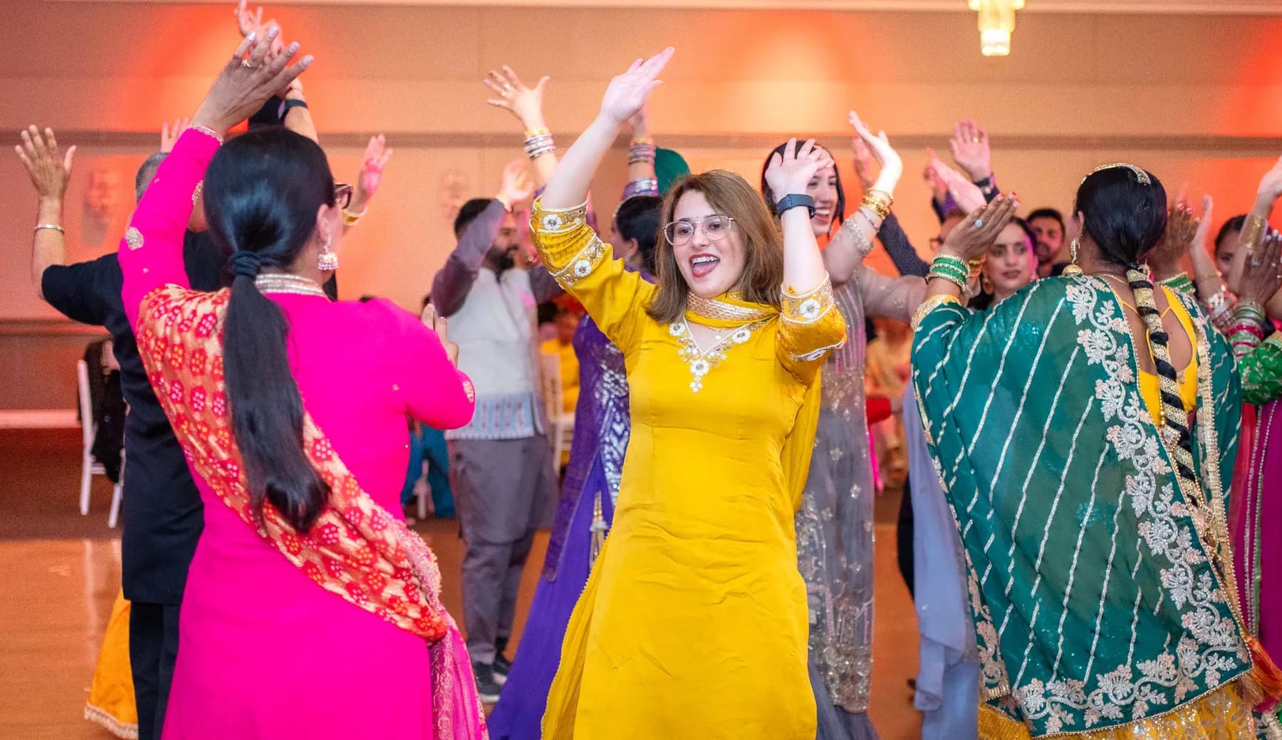 Guests enjoying the dance floor at Jessie and Erin’s Haldi celebration.