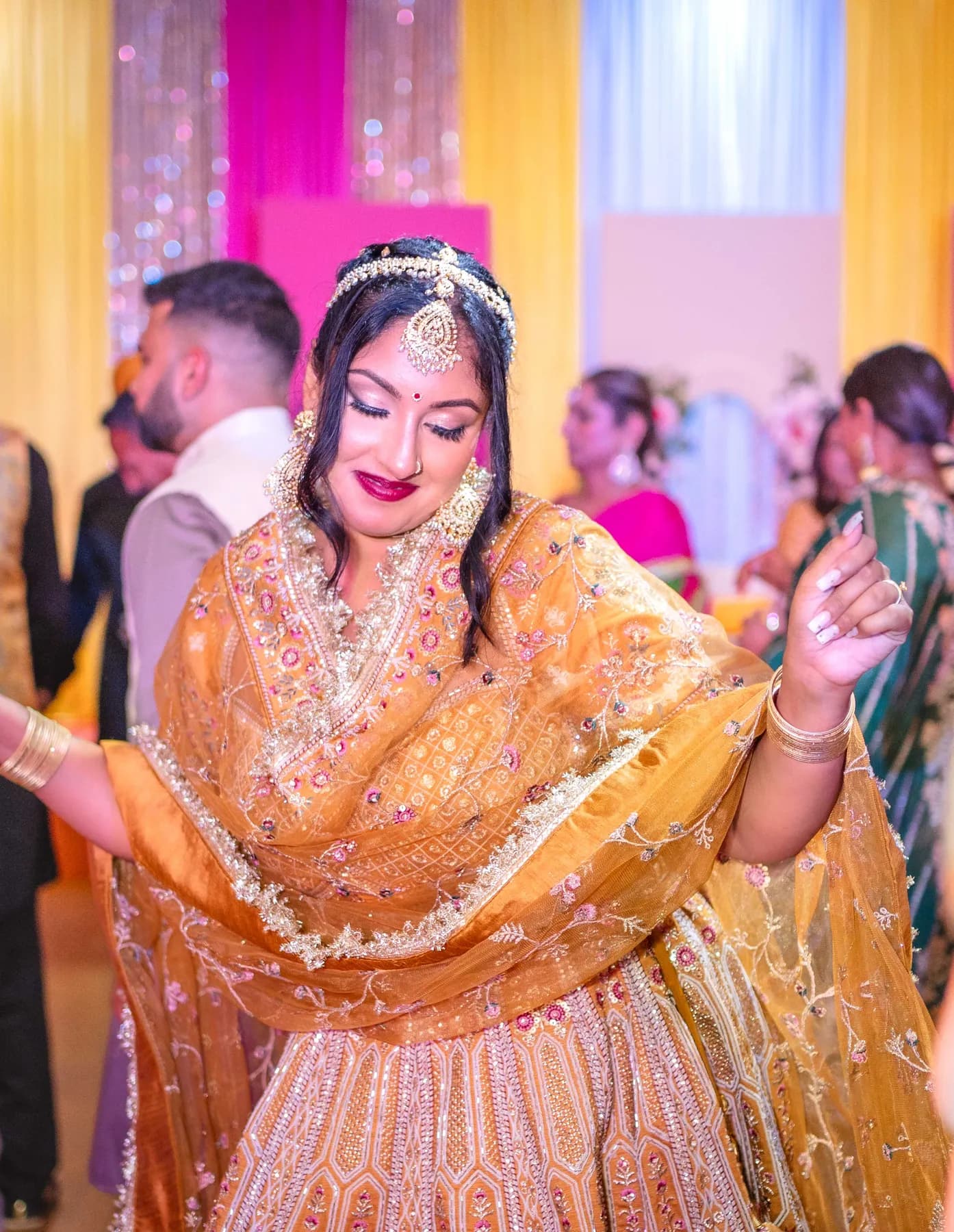 Guests enjoying the dance floor at Jessie and Erin’s Haldi celebration.