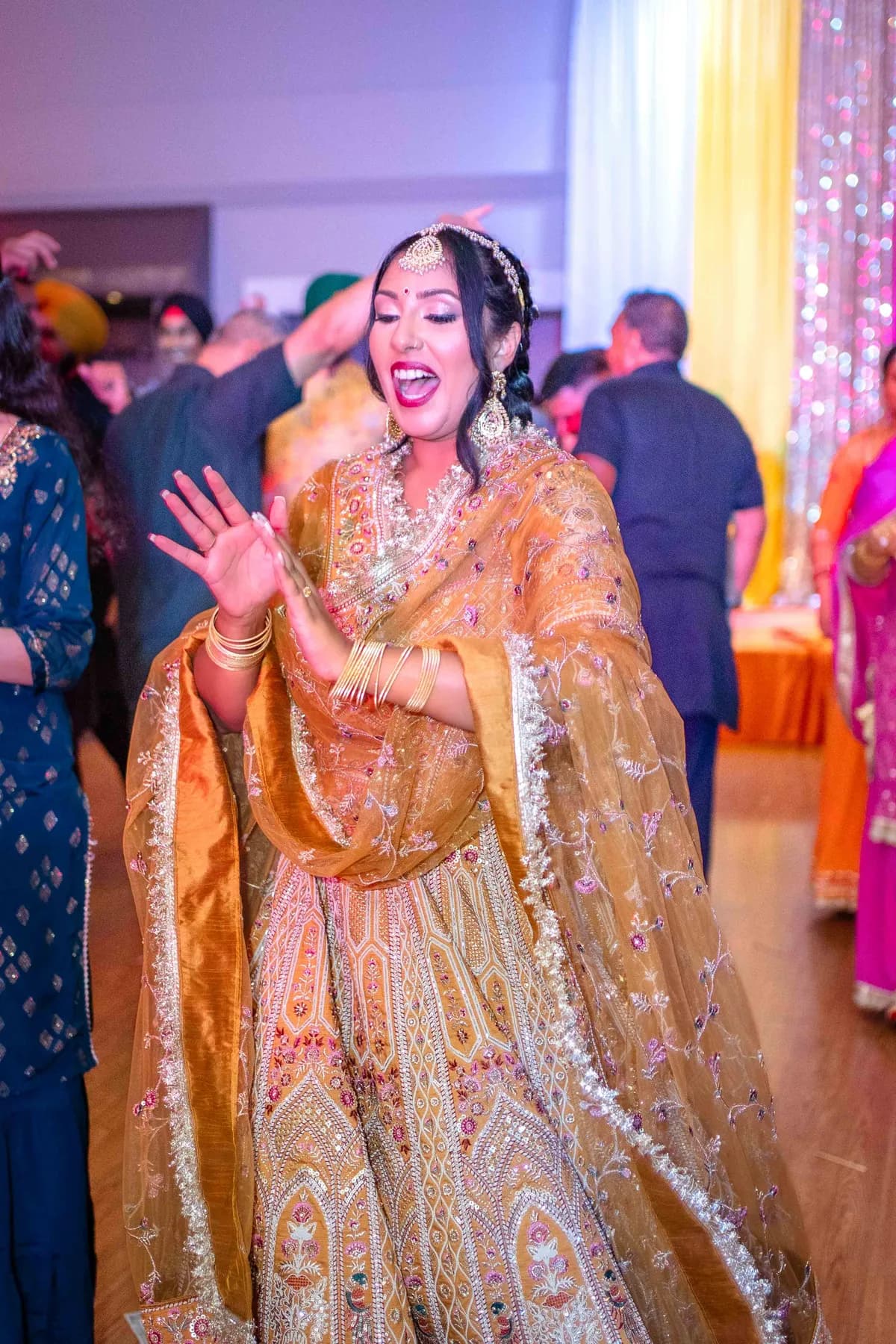Guests enjoying the dance floor at Jessie and Erin’s Haldi celebration.