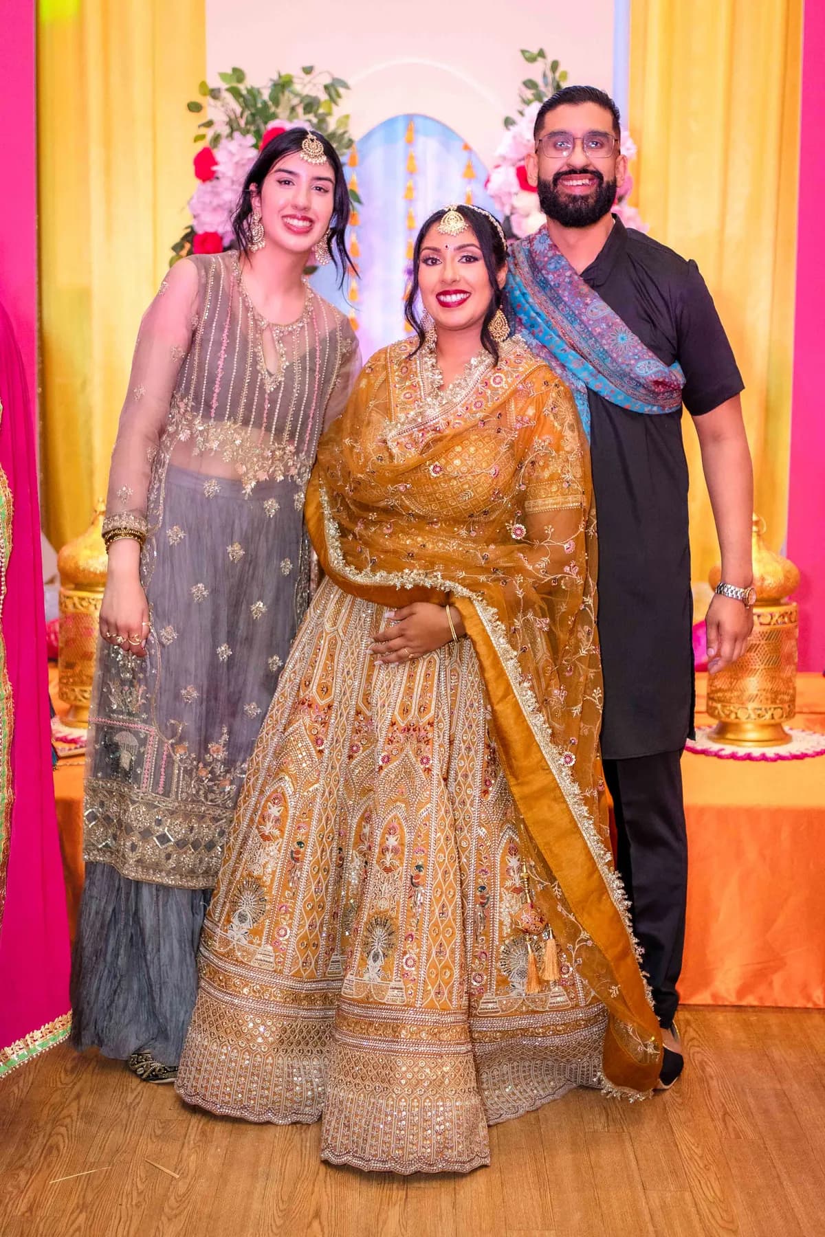 Guests posing together at Jessie and Erin’s Haldi celebration.