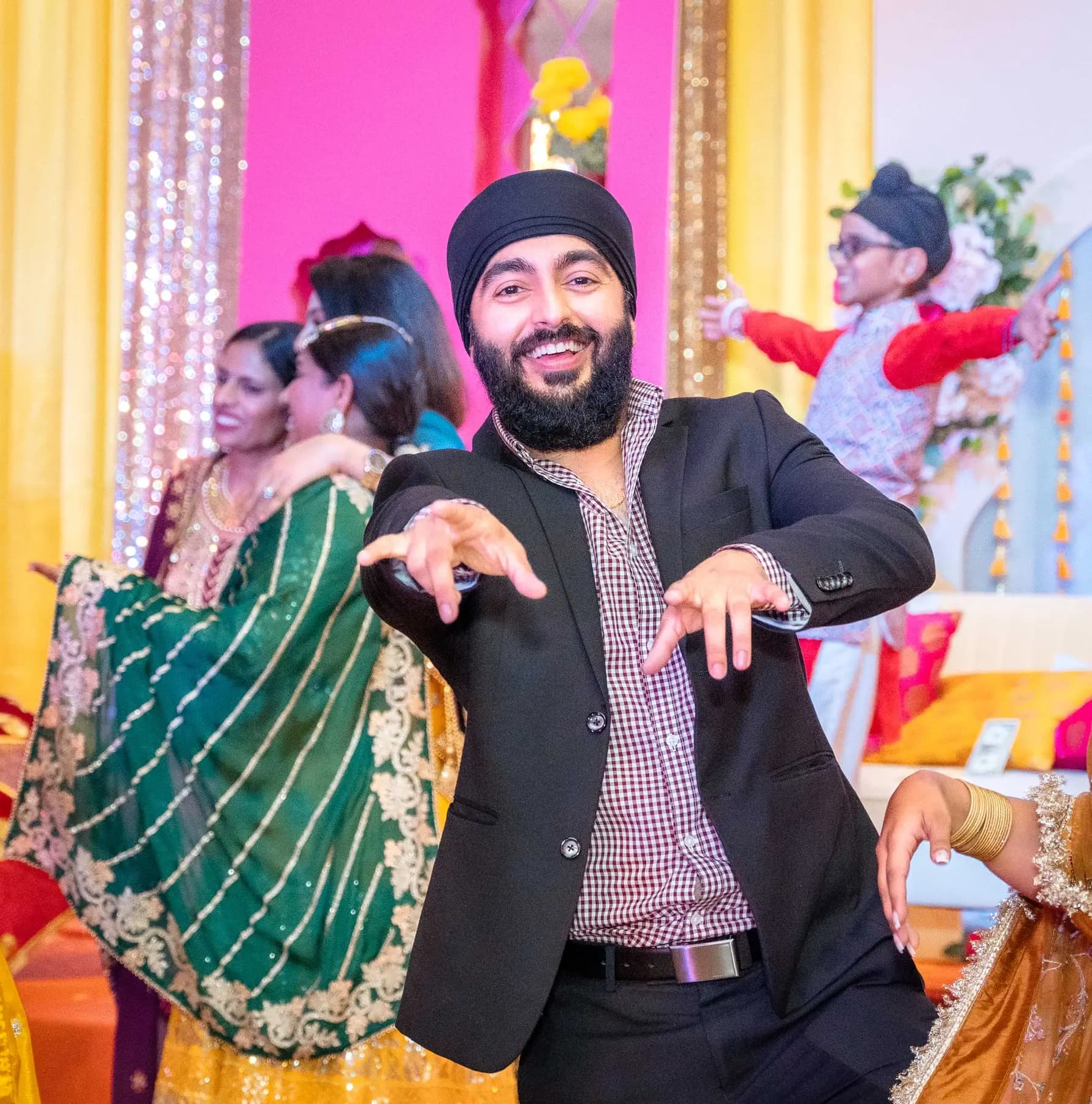 Guests posing together at Jessie and Erin’s Haldi celebration.