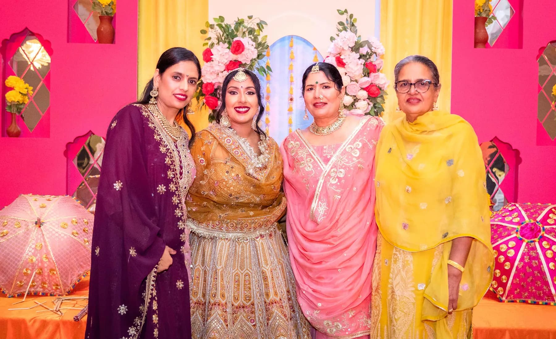 Guests posing together at Jessie and Erin’s Haldi celebration.