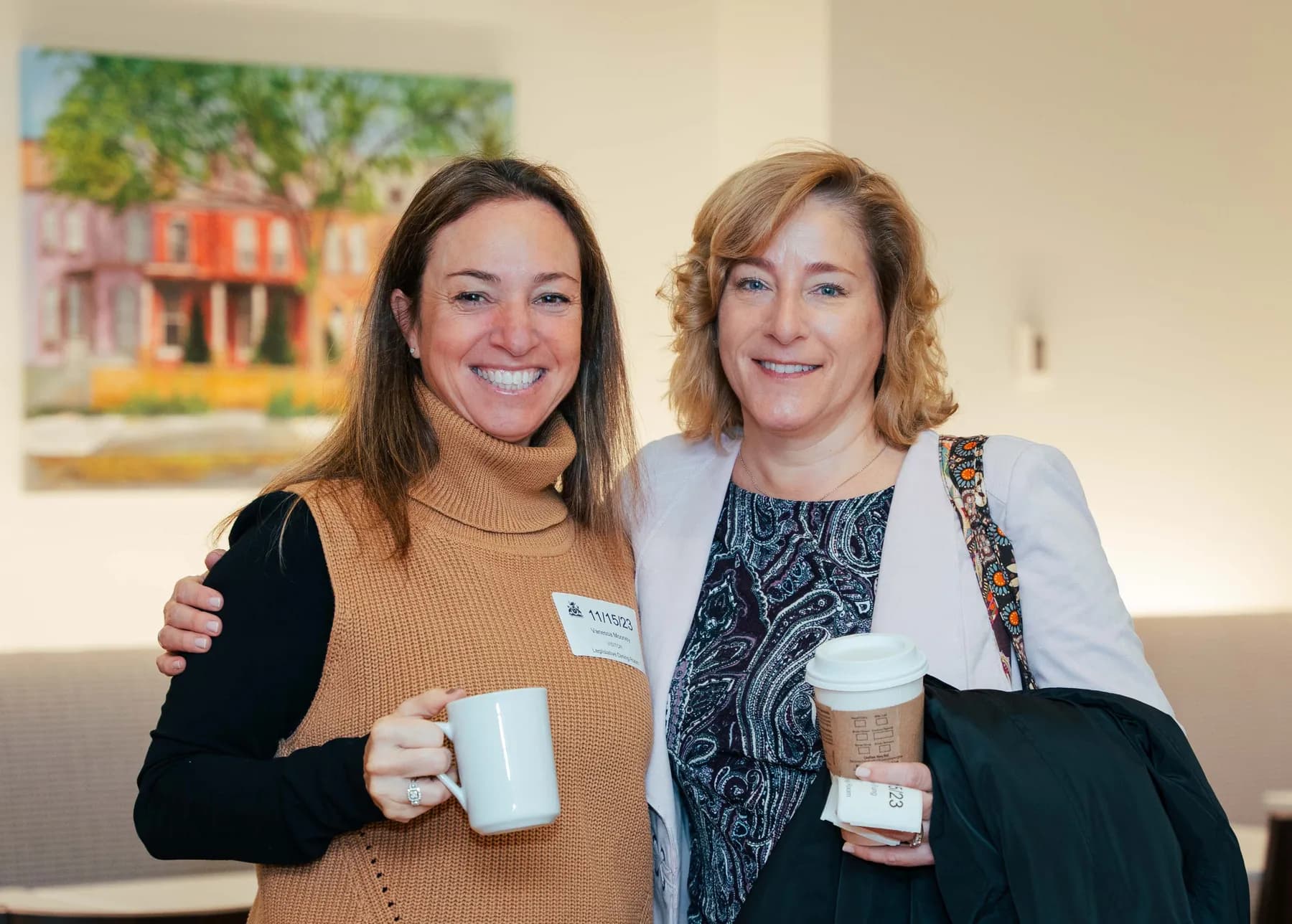 Two women posing together at the NPAO event at Queen’s Park.