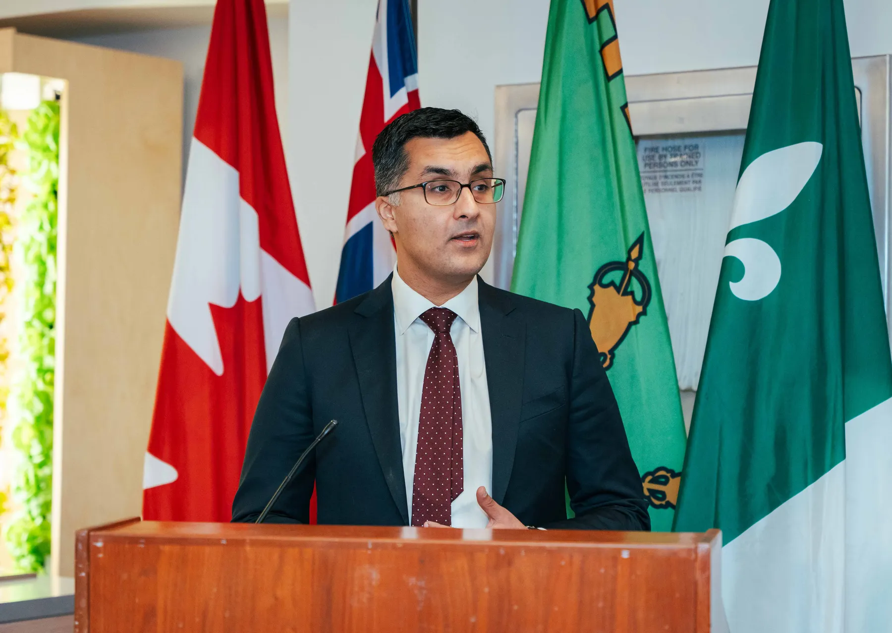 A man speaking at the lectern at the NPAO event at Queen’s Park.