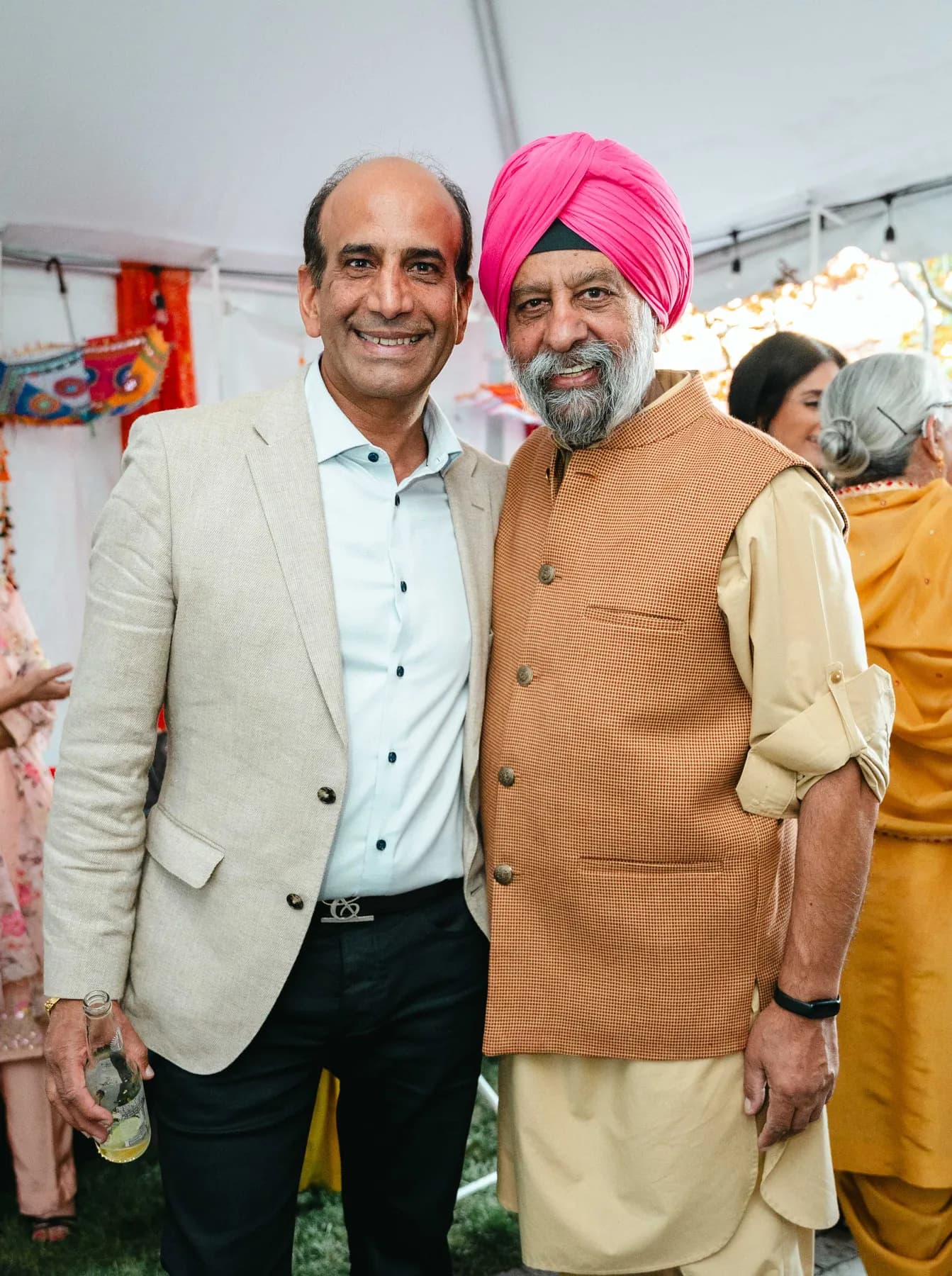Two men posing together at Aaron’s Haldi celebration.
