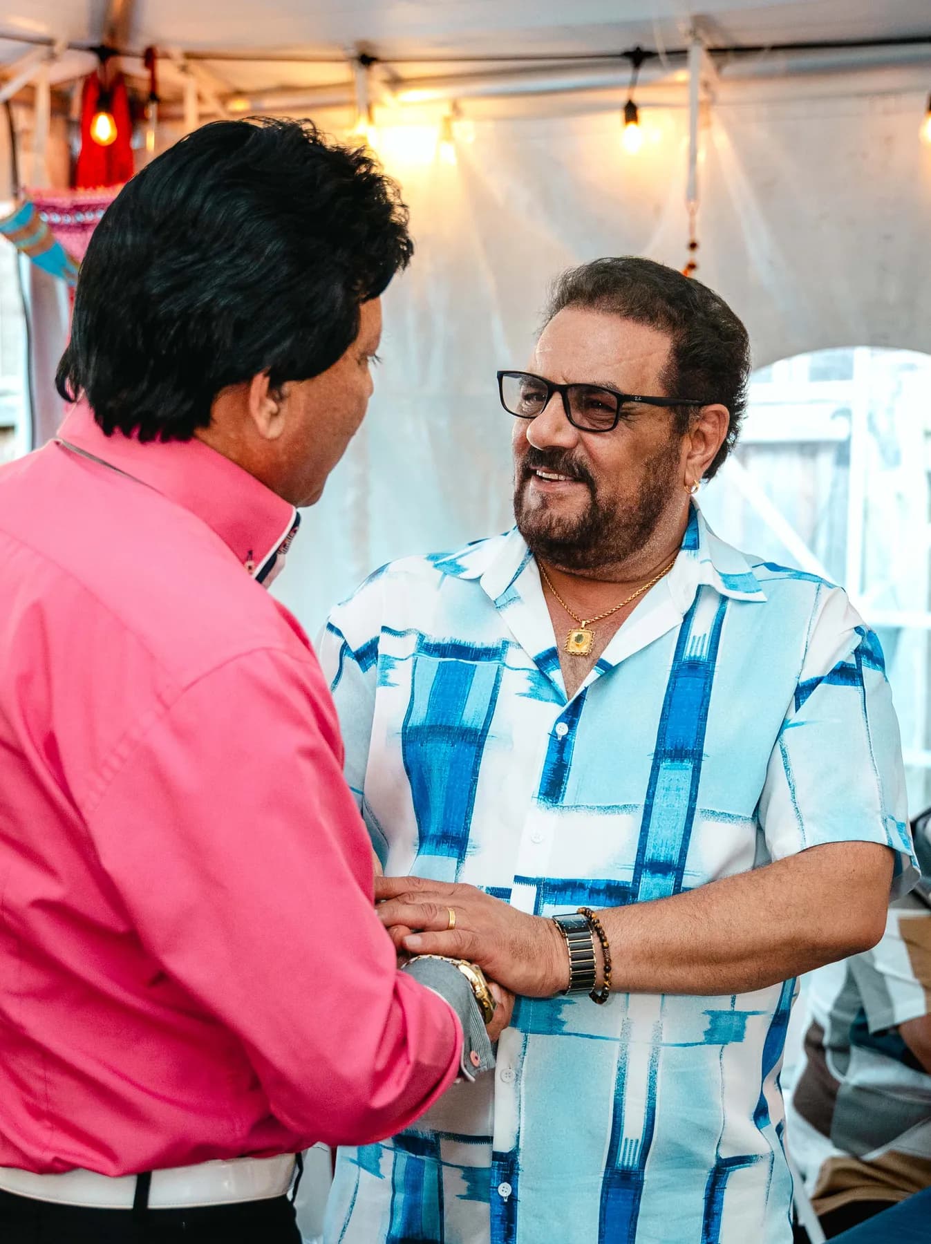 Guests in conversation at Aaron’s Haldi celebration.