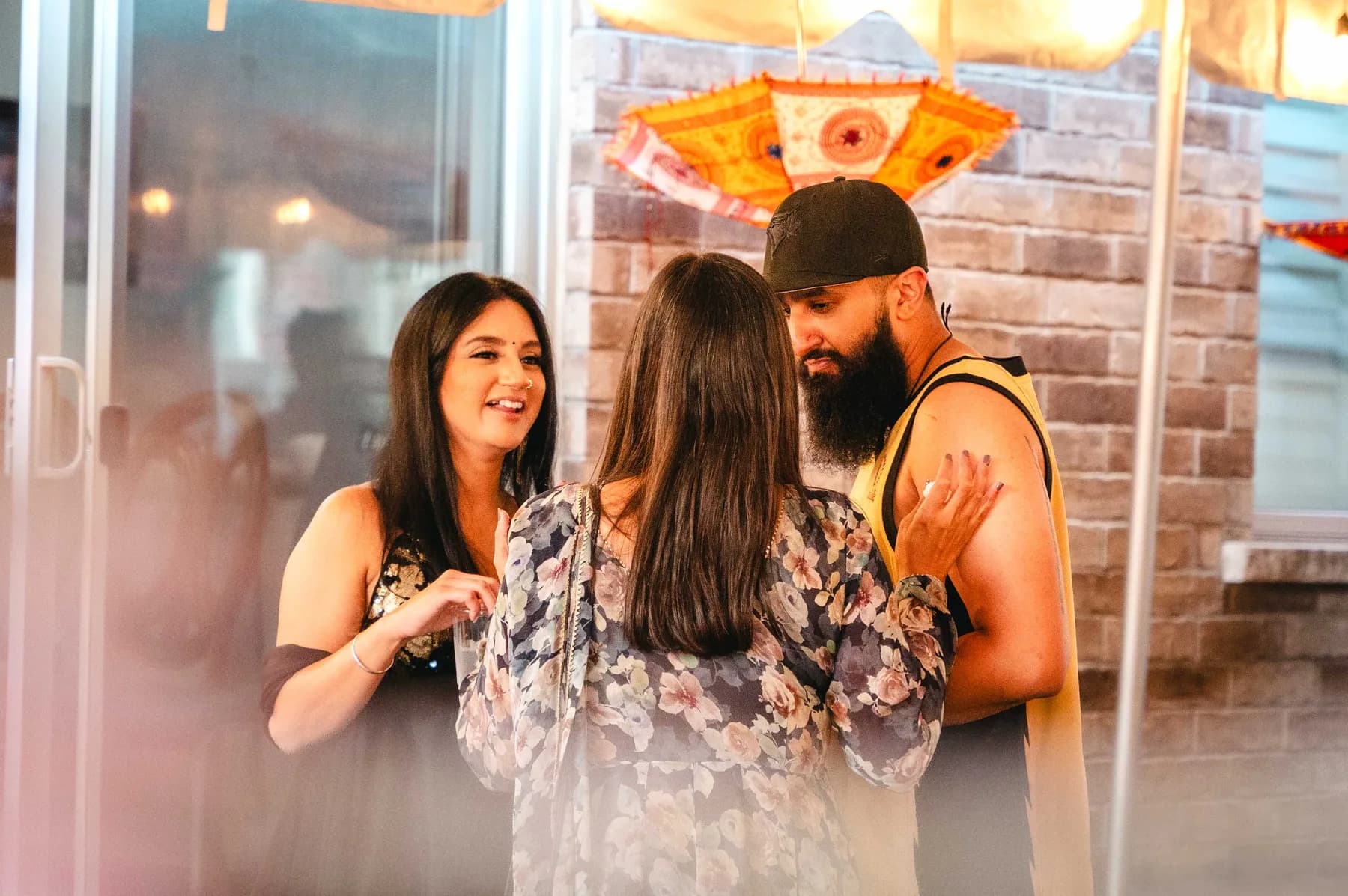 Guests in conversation at Aaron’s Haldi celebration.