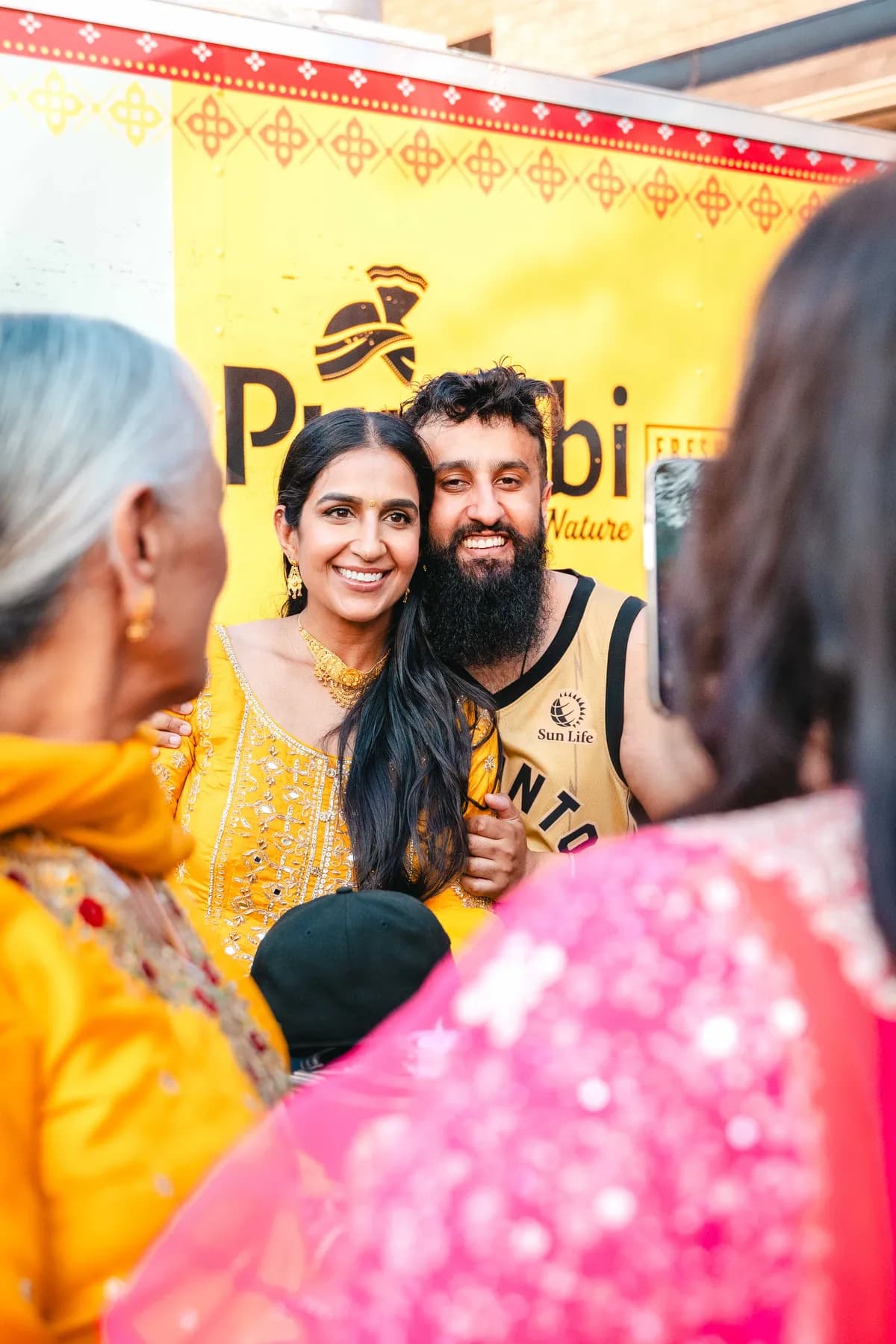 Guests in conversation at Aaron’s Haldi celebration.