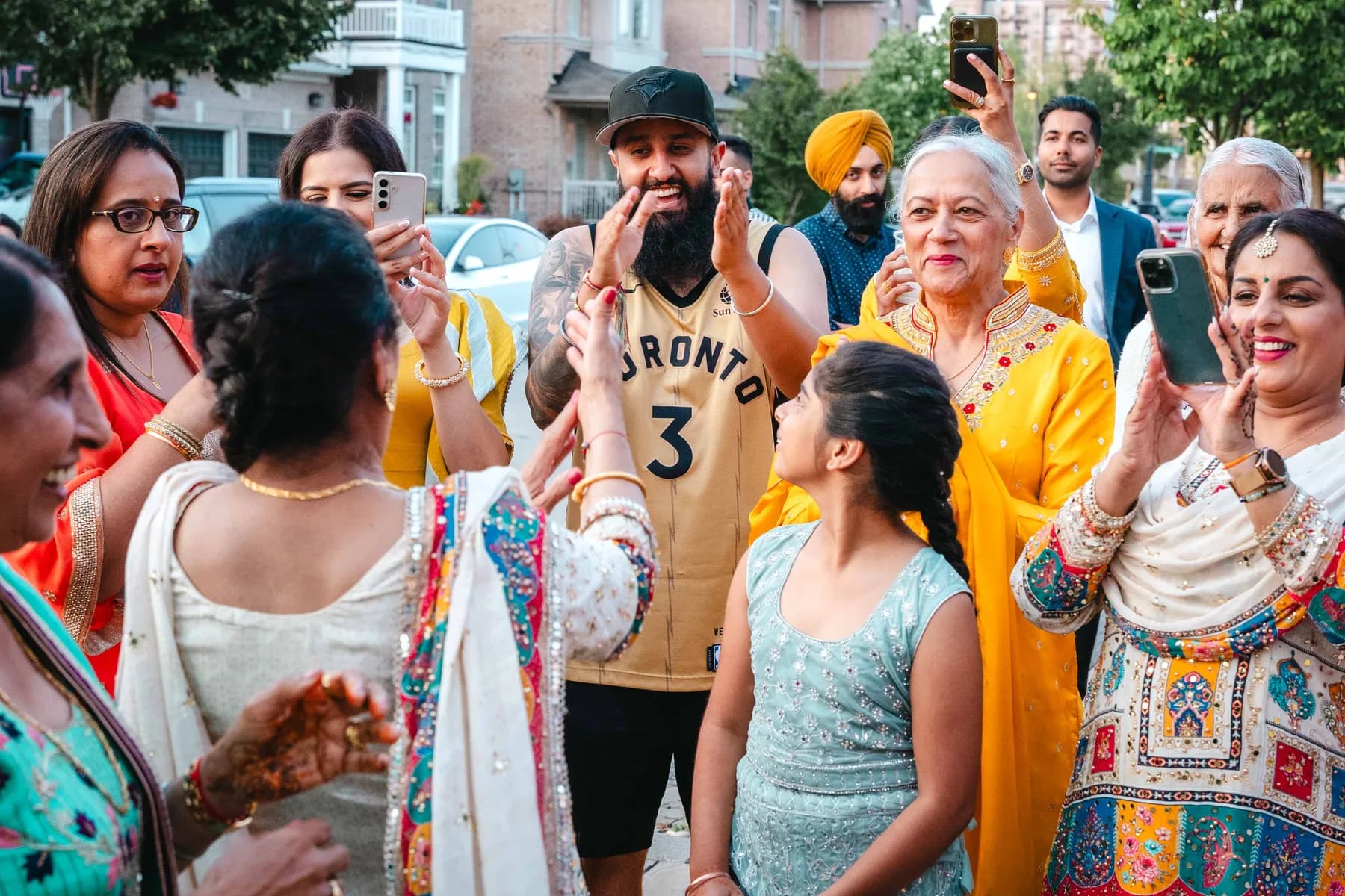 Guests greeting each other outdoors at Aaron’s Haldi celebration.
