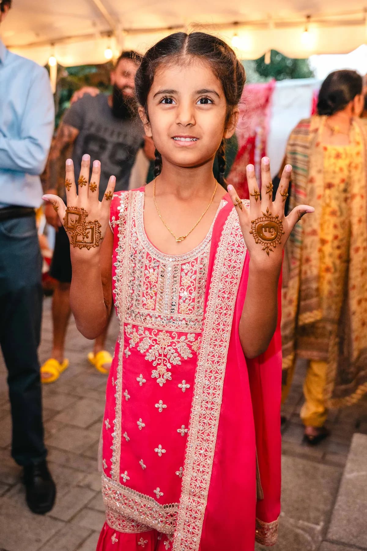 A portrait of a child at Aaron’s Haldi celebration.