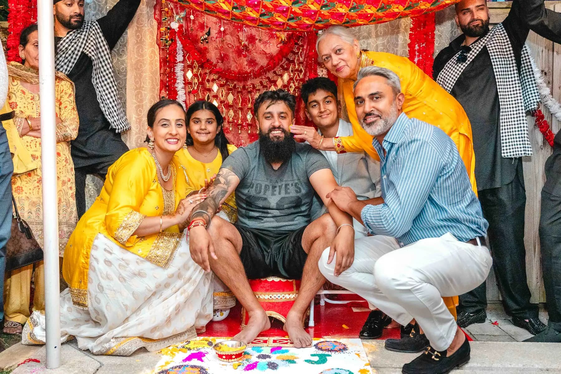 Guests posing during the Haldi ceremony at Aaron’s Haldi celebration.