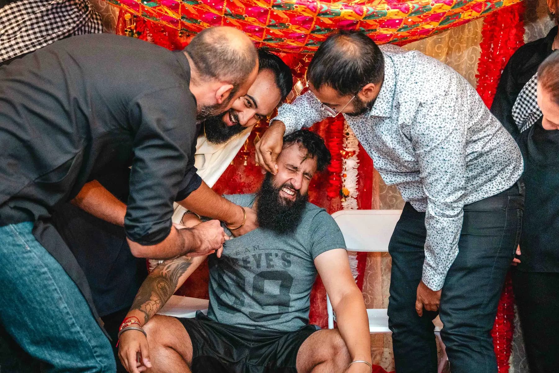 Guests gathered around the Haldi ceremony at Aaron’s Haldi celebration.