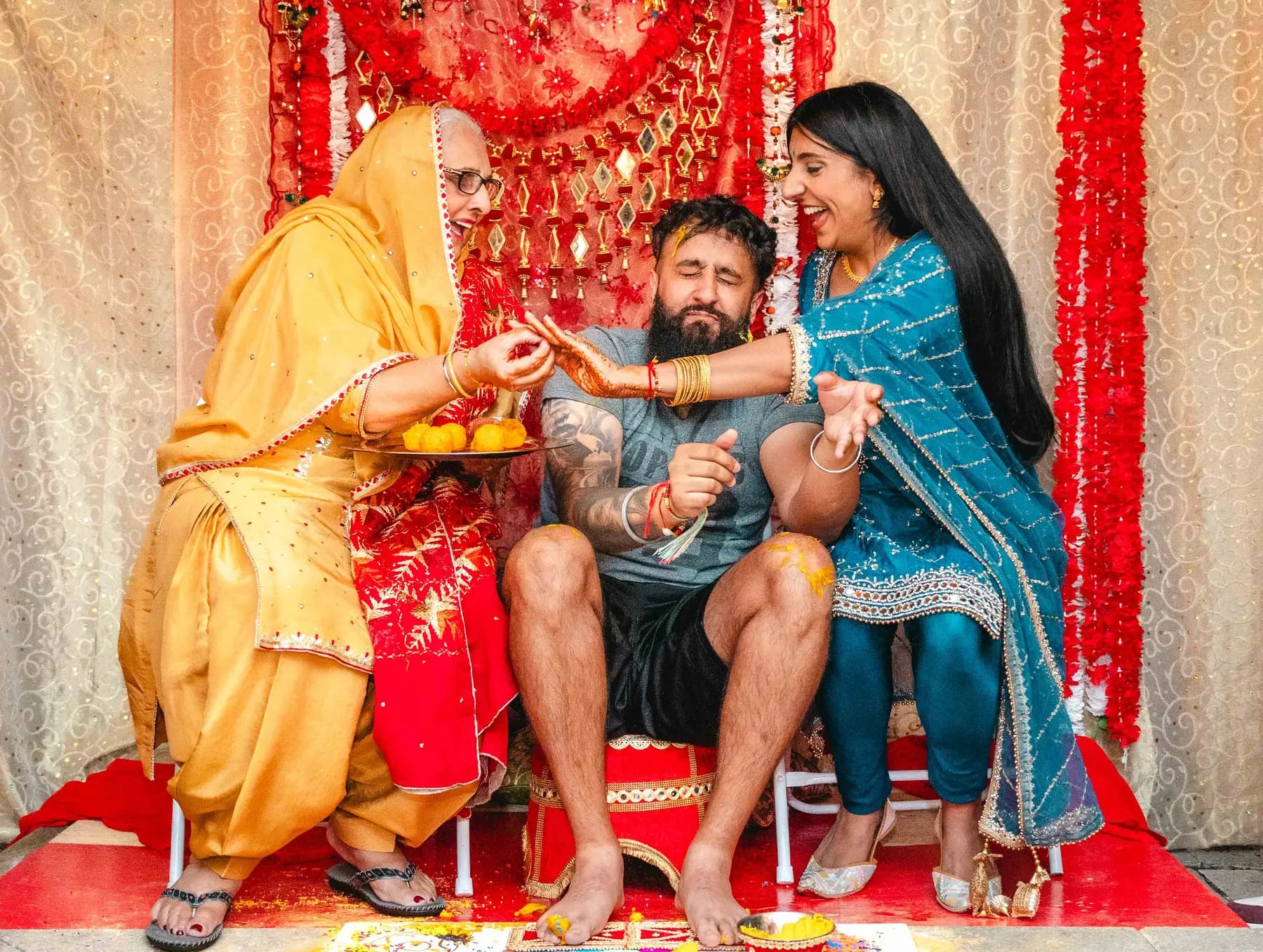 Guests gathered around the Haldi ceremony at Aaron’s Haldi celebration.