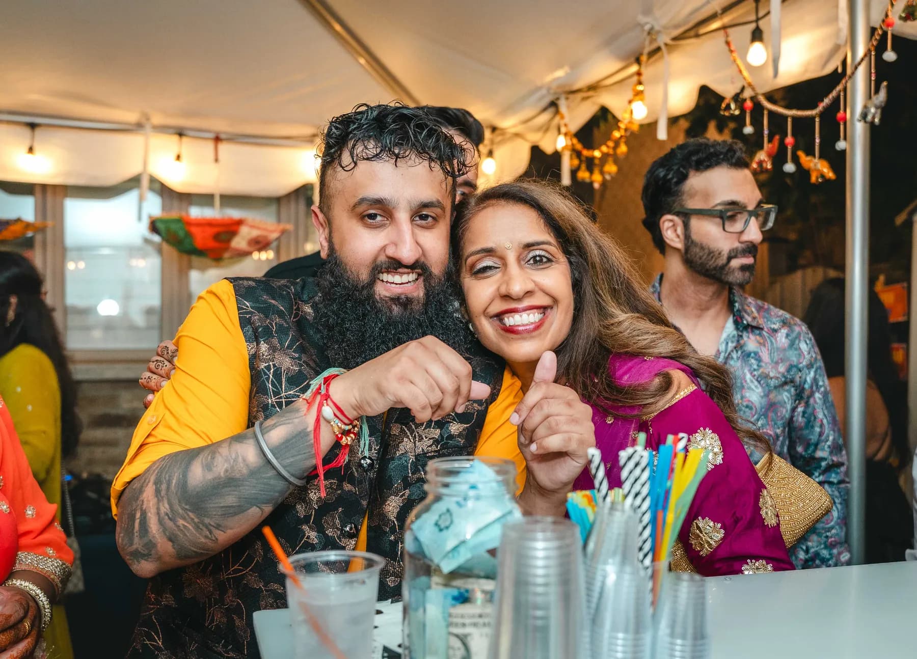Guests dancing and celebrating outdoors at Aaron’s Haldi celebration.