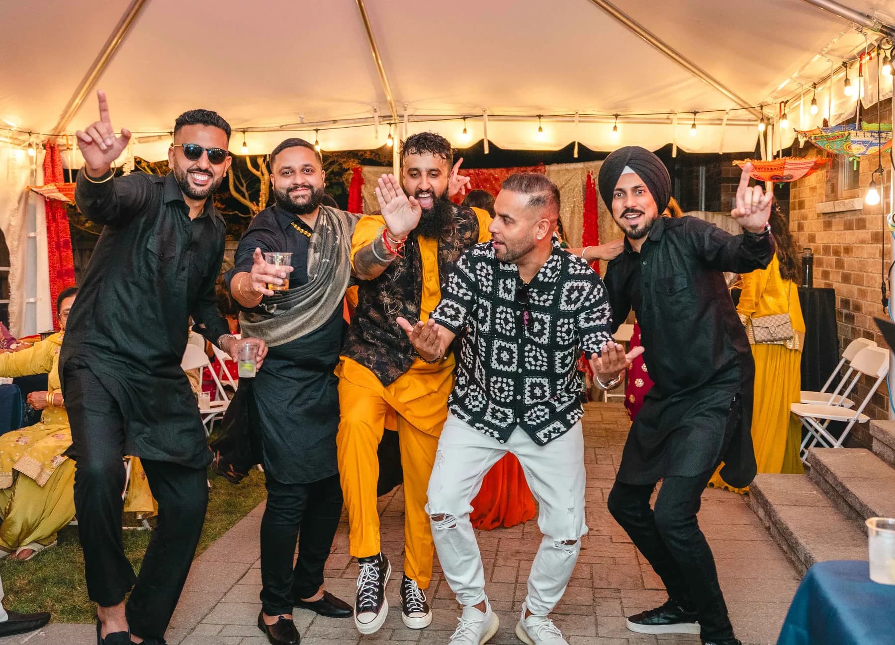 Guests posing together at Aaron’s Haldi celebration.