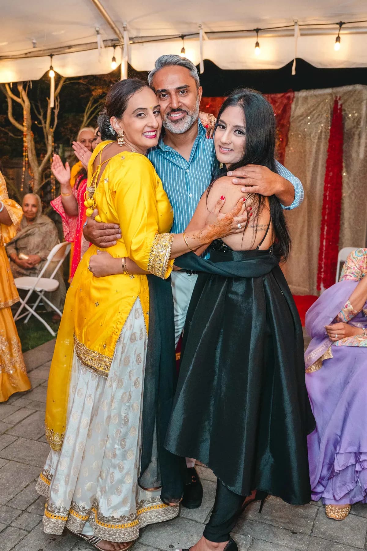 Guests posing and celebrating together at Aaron’s Haldi celebration.