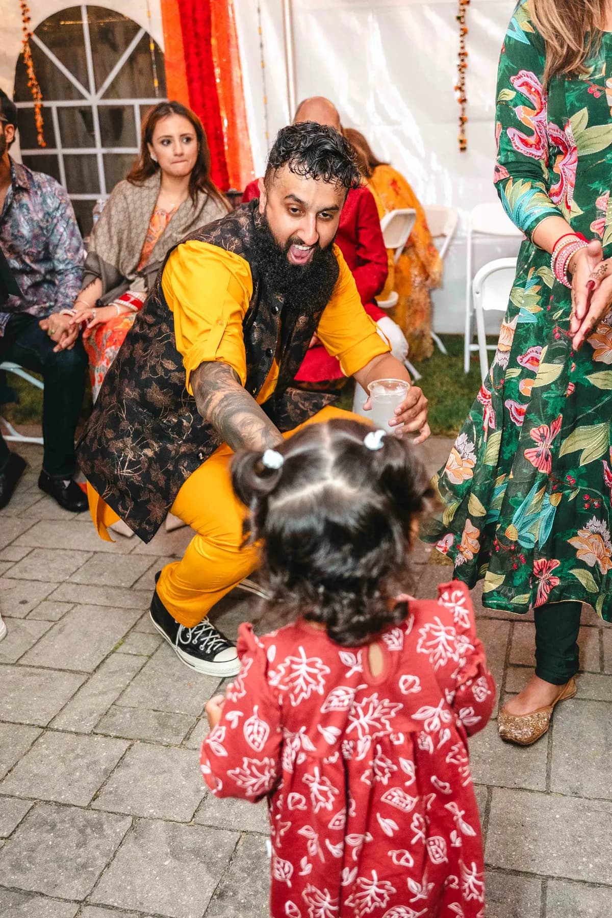 Guests posing and celebrating together at Aaron’s Haldi celebration.
