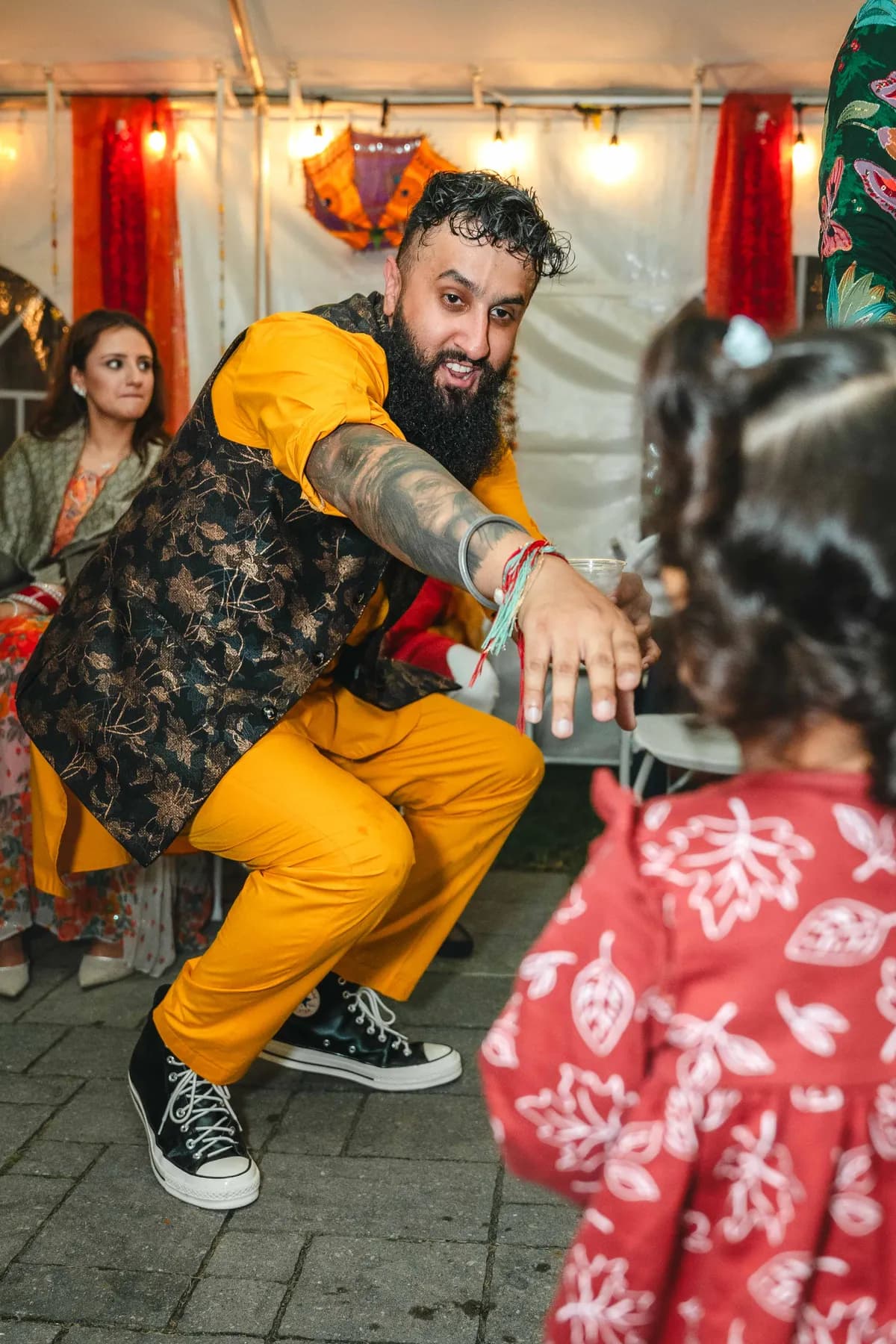 Guests posing and celebrating together at Aaron’s Haldi celebration.