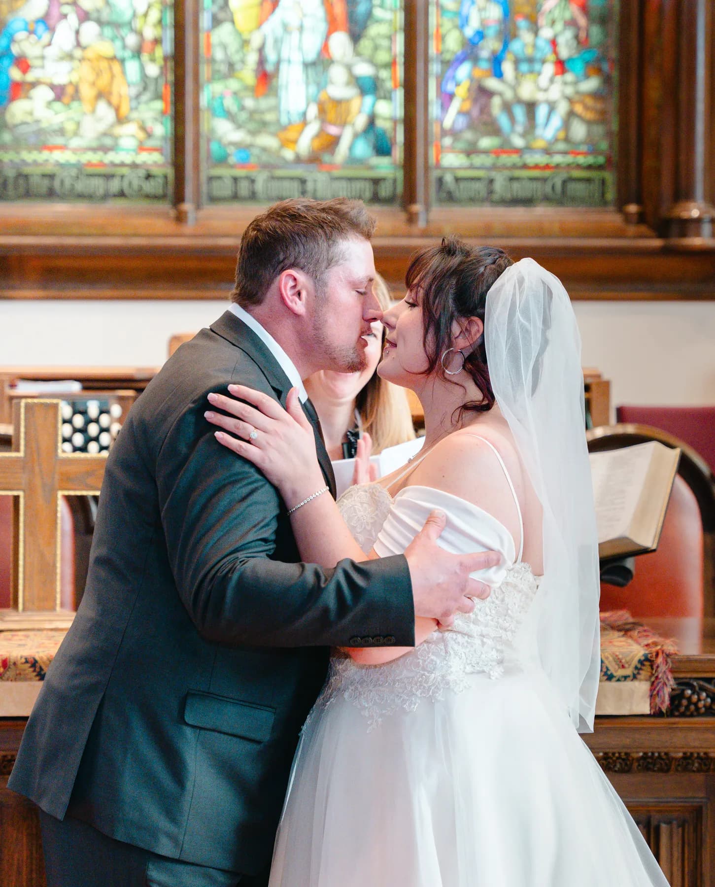 The couple embracing during the ceremony at Kody and Jaz’s wedding.