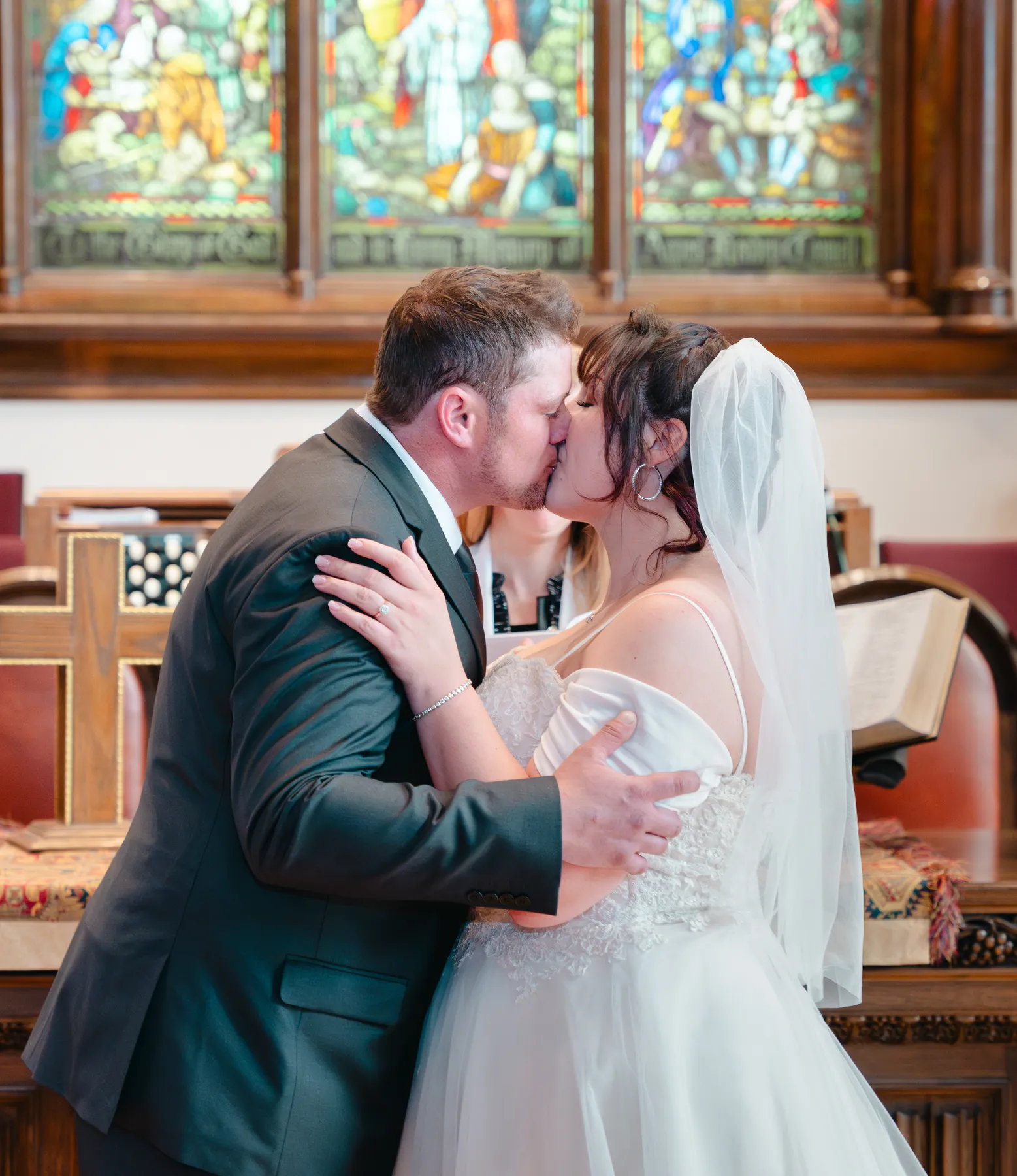 The couple embracing during the ceremony at Kody and Jaz’s wedding.
