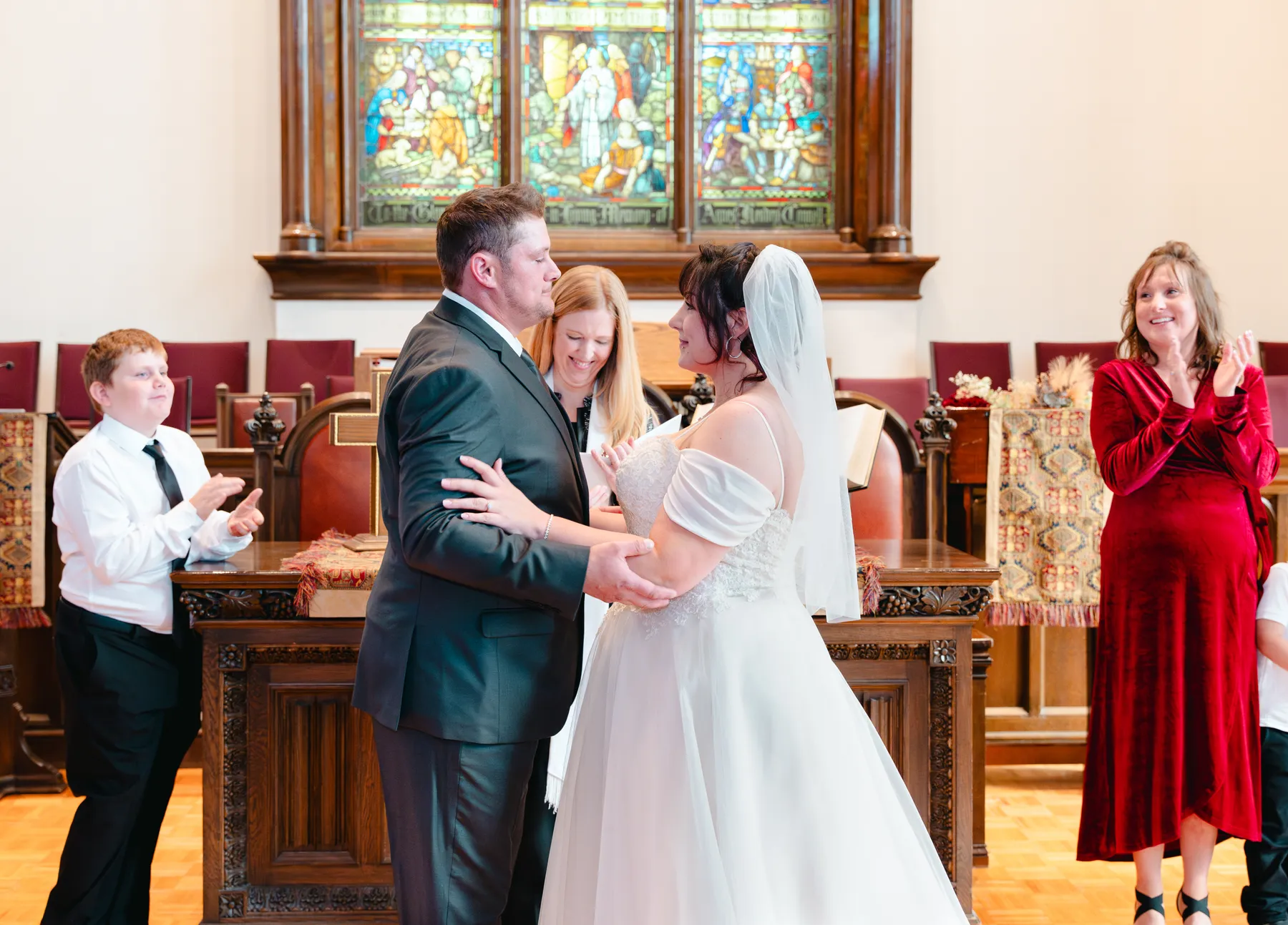 The couple embracing during the ceremony at Kody and Jaz’s wedding.