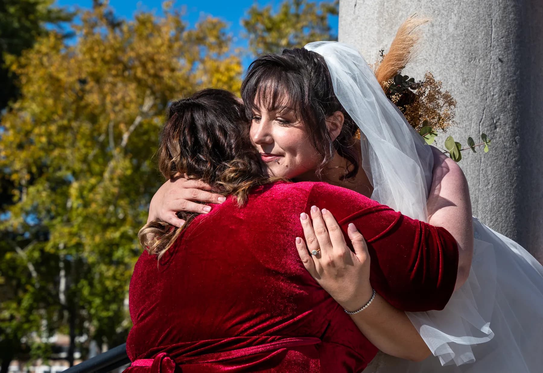 The bride greeting guests outside the church at Kody and Jaz’s wedding.