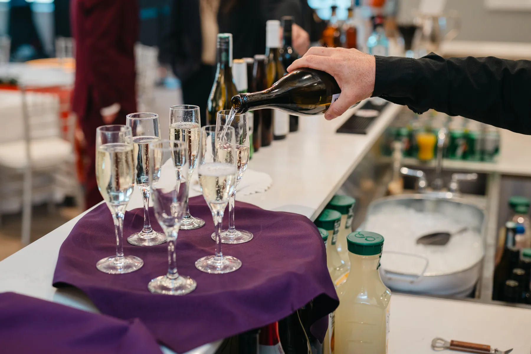 Drinks being poured into glasses at Jenna and Jake’s Halloween party.