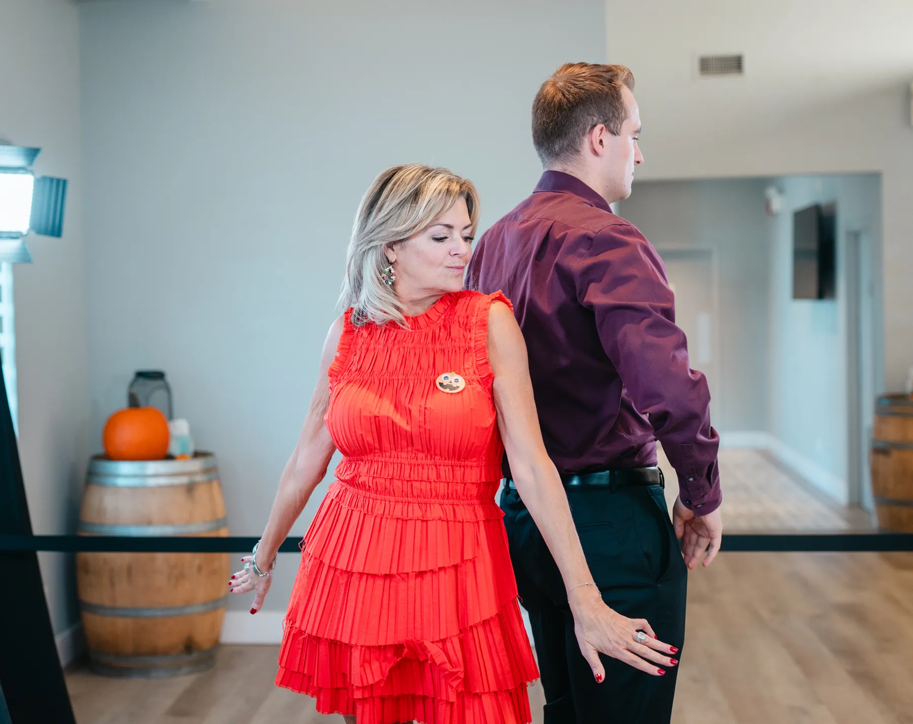 Guests posing and dancing indoors at Jenna and Jake’s Halloween party.
