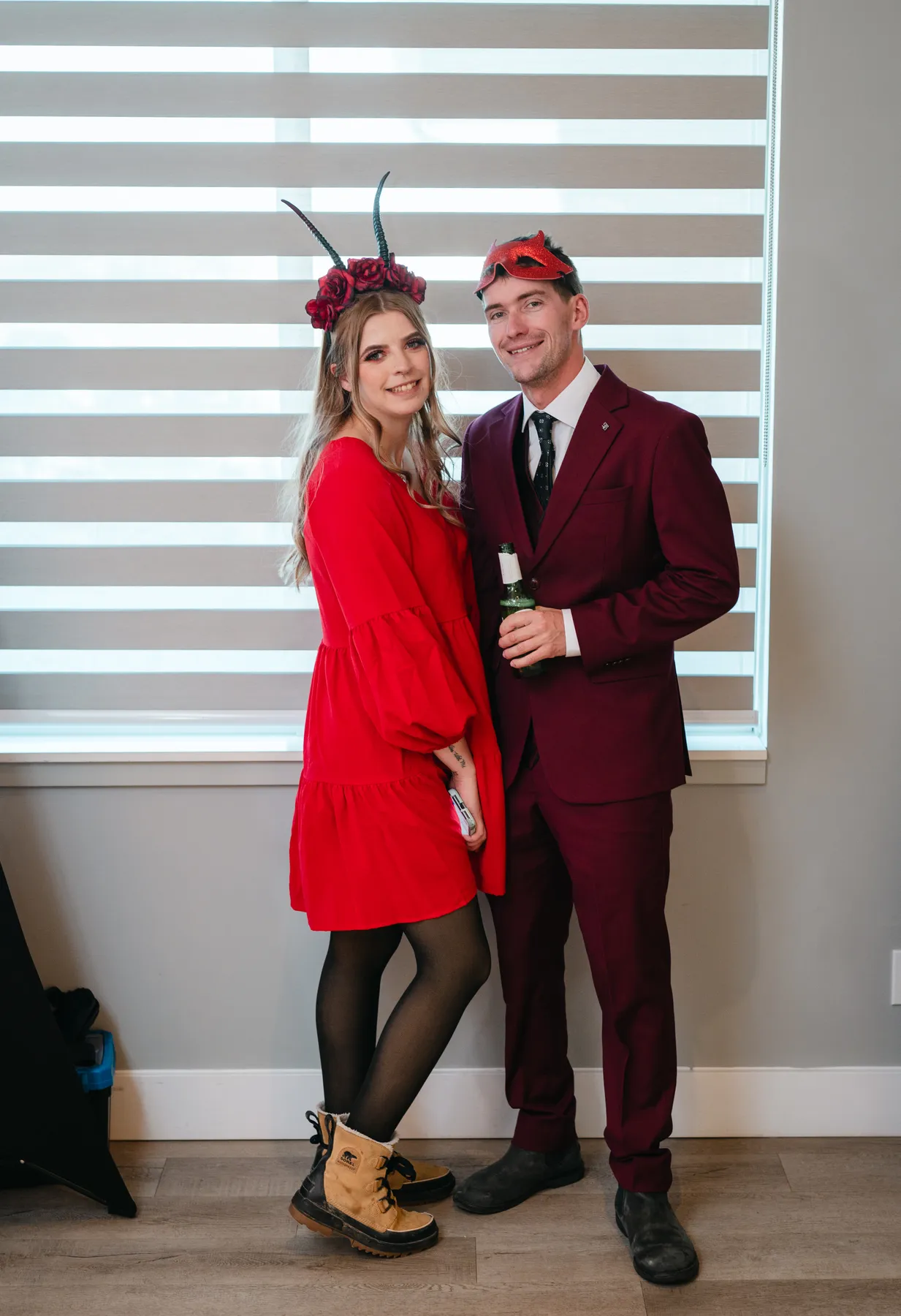 Guests talking and posing together at Jenna and Jake’s Halloween party.