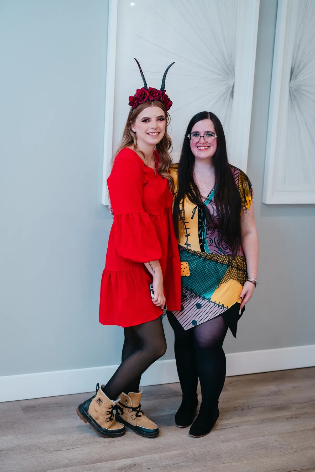 Groups of costumed guests posing indoors at Jenna and Jake’s Halloween party.