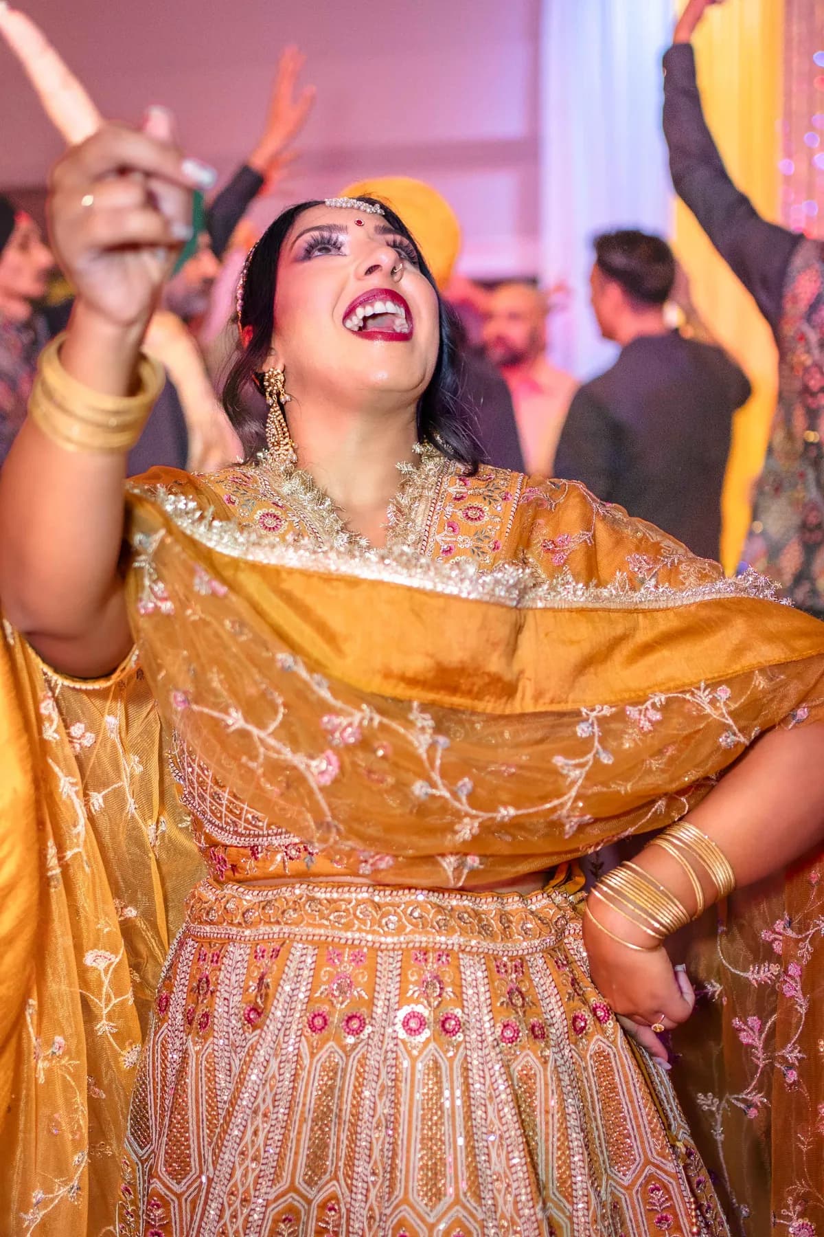 Guests enjoying the dance floor at Jessie and Erin’s Haldi celebration.