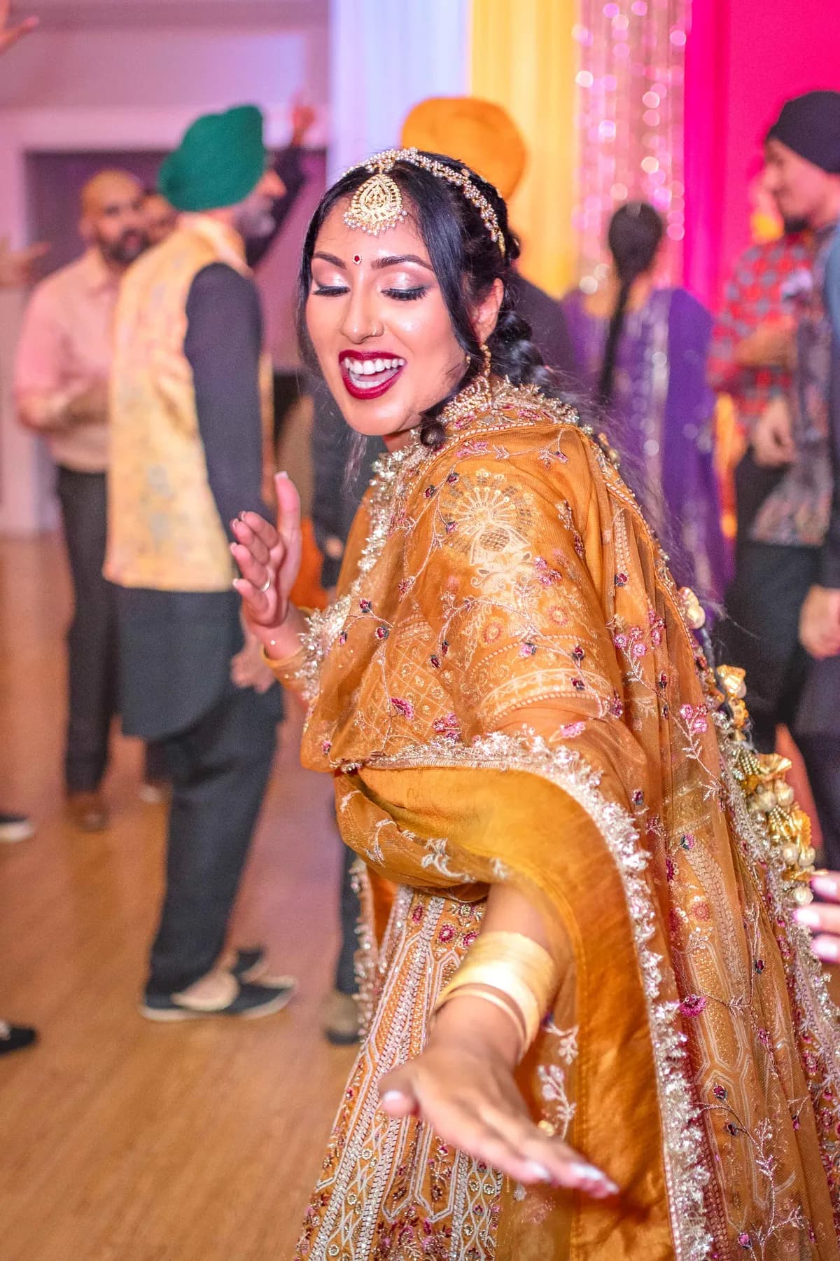 Guests enjoying the dance floor at Jessie and Erin’s Haldi celebration.