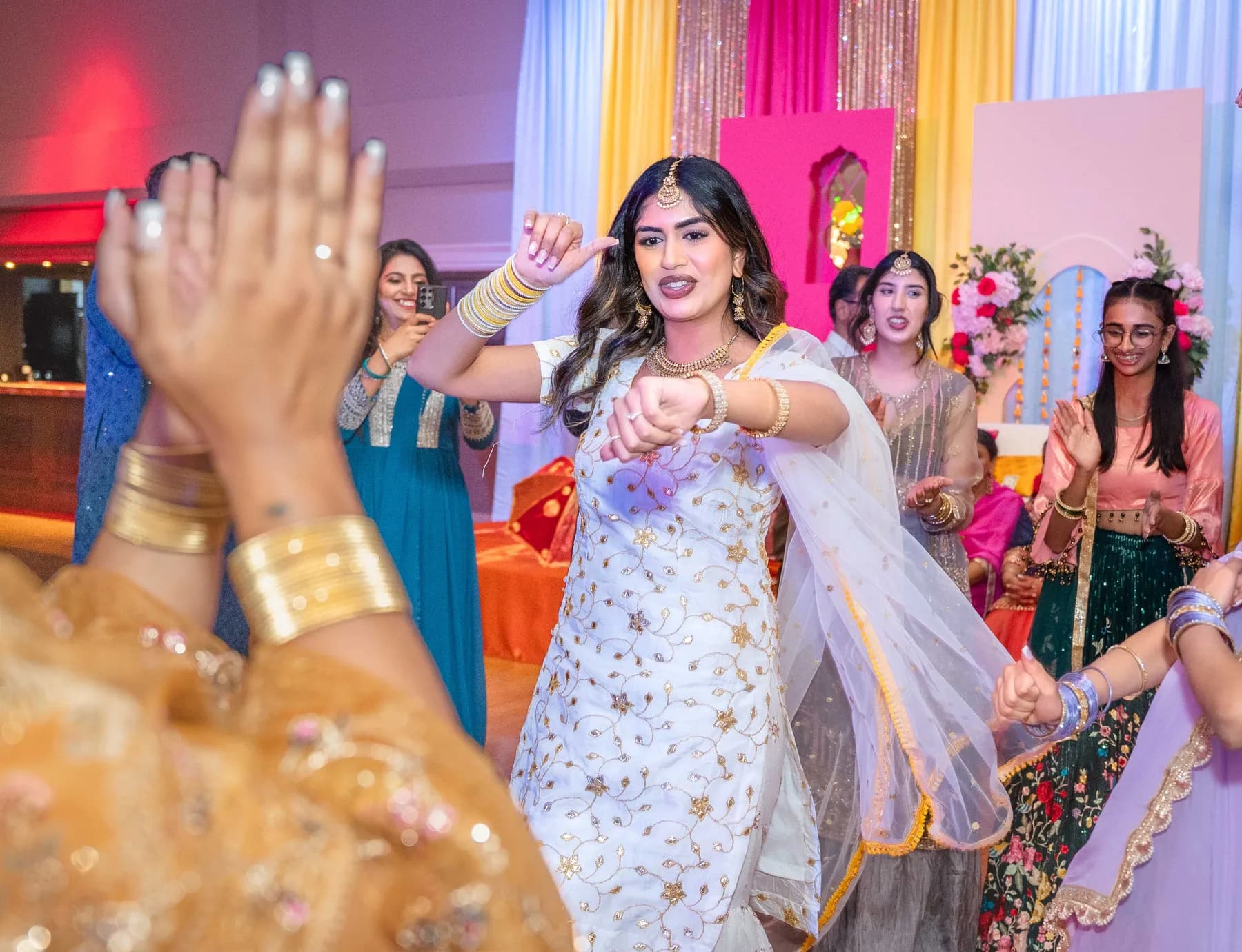 Guests enjoying the dance floor at Jessie and Erin’s Haldi celebration.