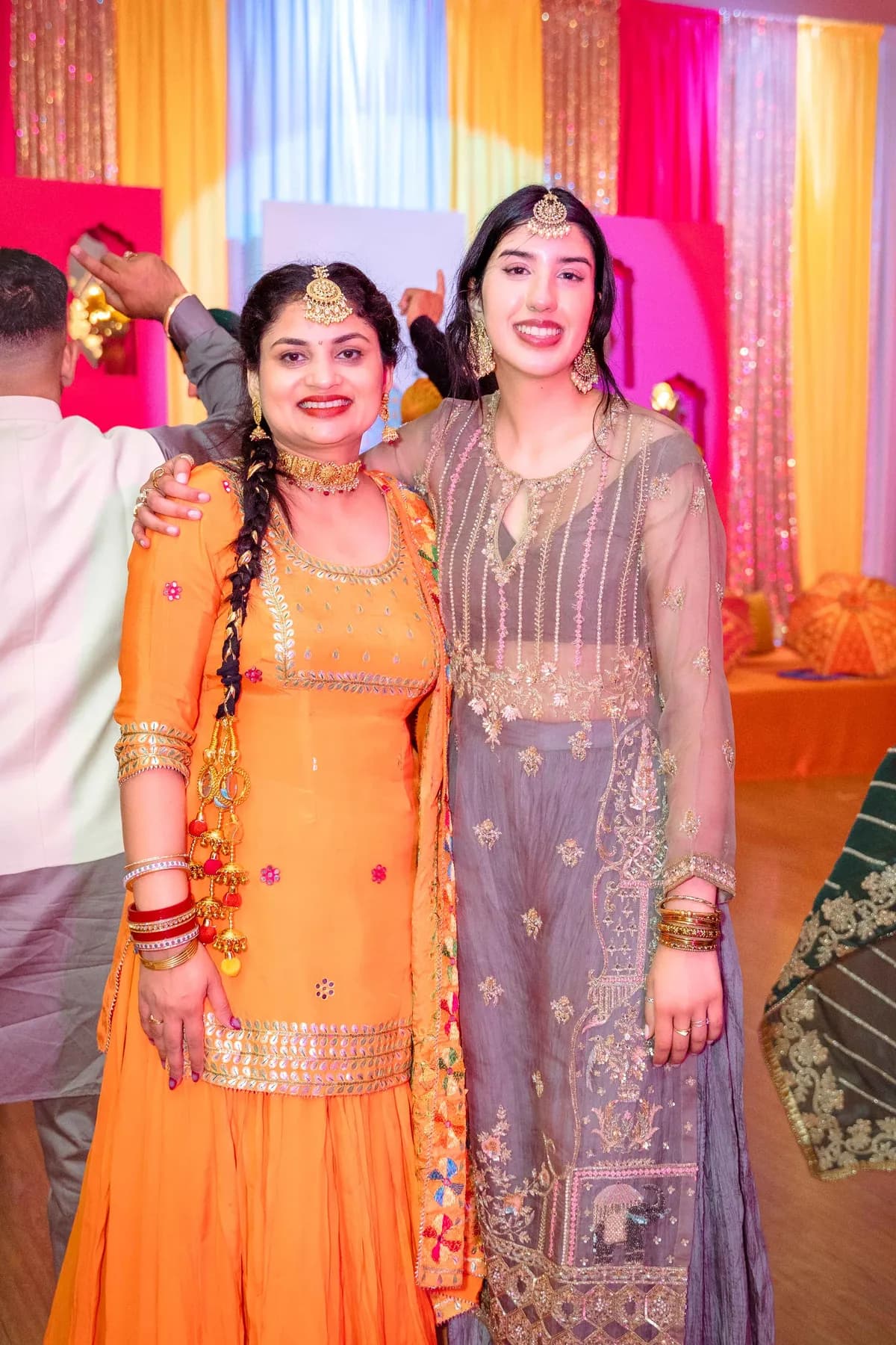 Guests posing together at Jessie and Erin’s Haldi celebration.