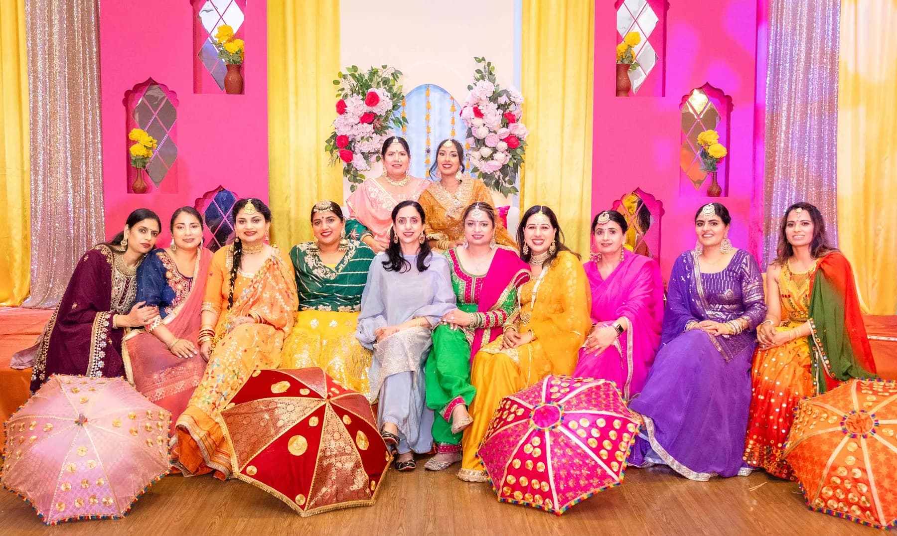 Guests posing together at Jessie and Erin’s Haldi celebration.