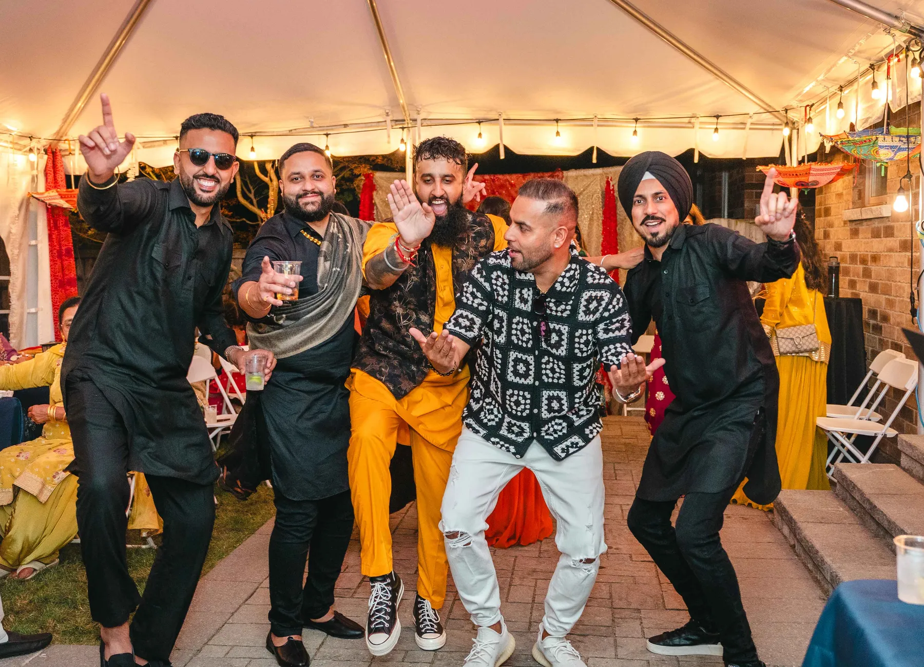 Guests posing together at Aaron’s Haldi celebration.