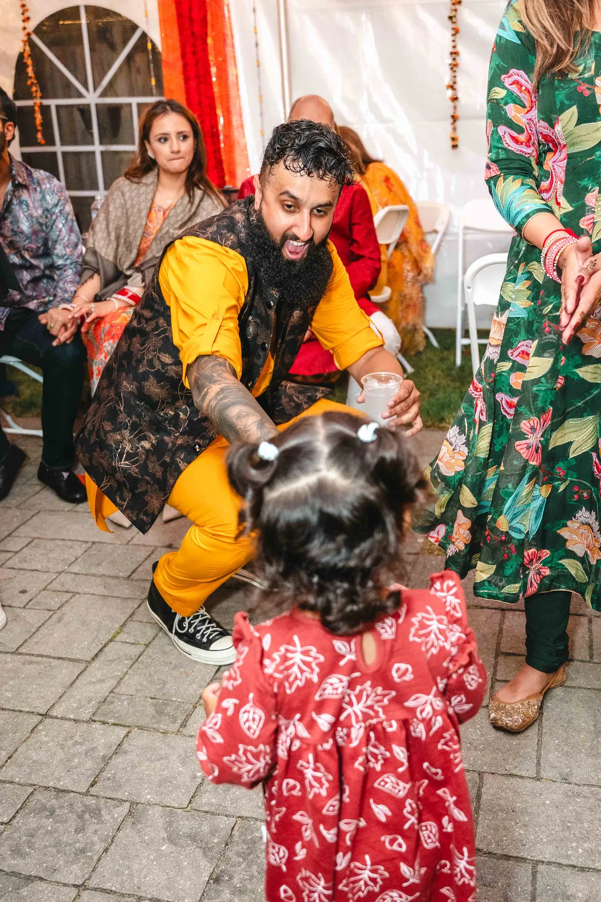 Guests posing and celebrating together at Aaron’s Haldi celebration.