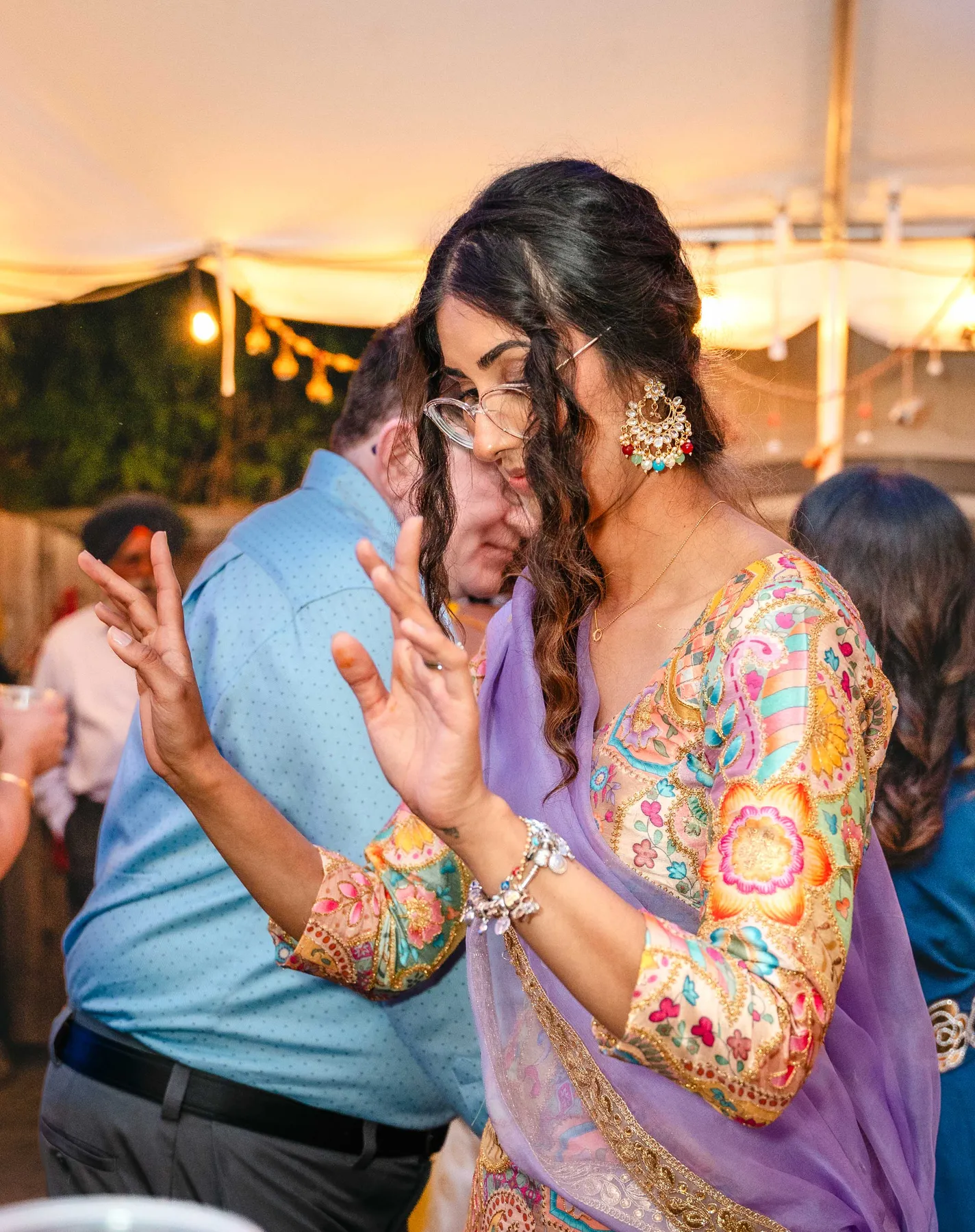 A candid moment between two guests at Aaron’s Haldi celebration.