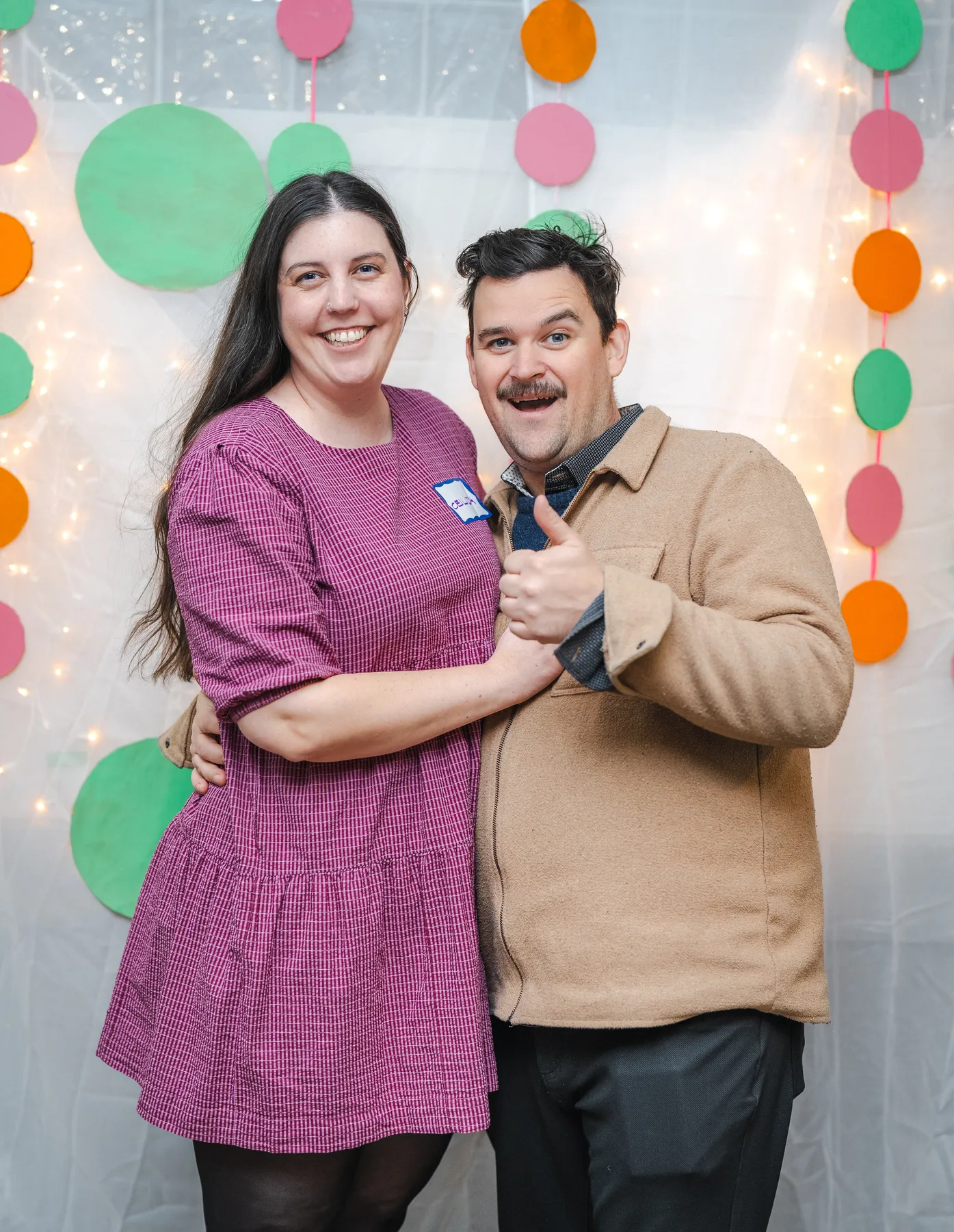 A couple posing together at Alison’s birthday celebration.