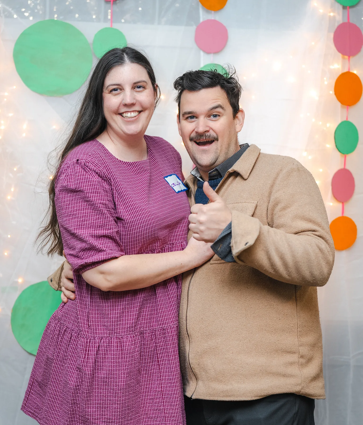 A couple posing together at Alison’s birthday celebration.