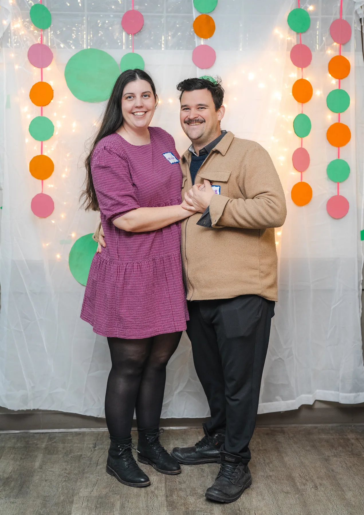 A couple posing together at Alison’s birthday celebration.