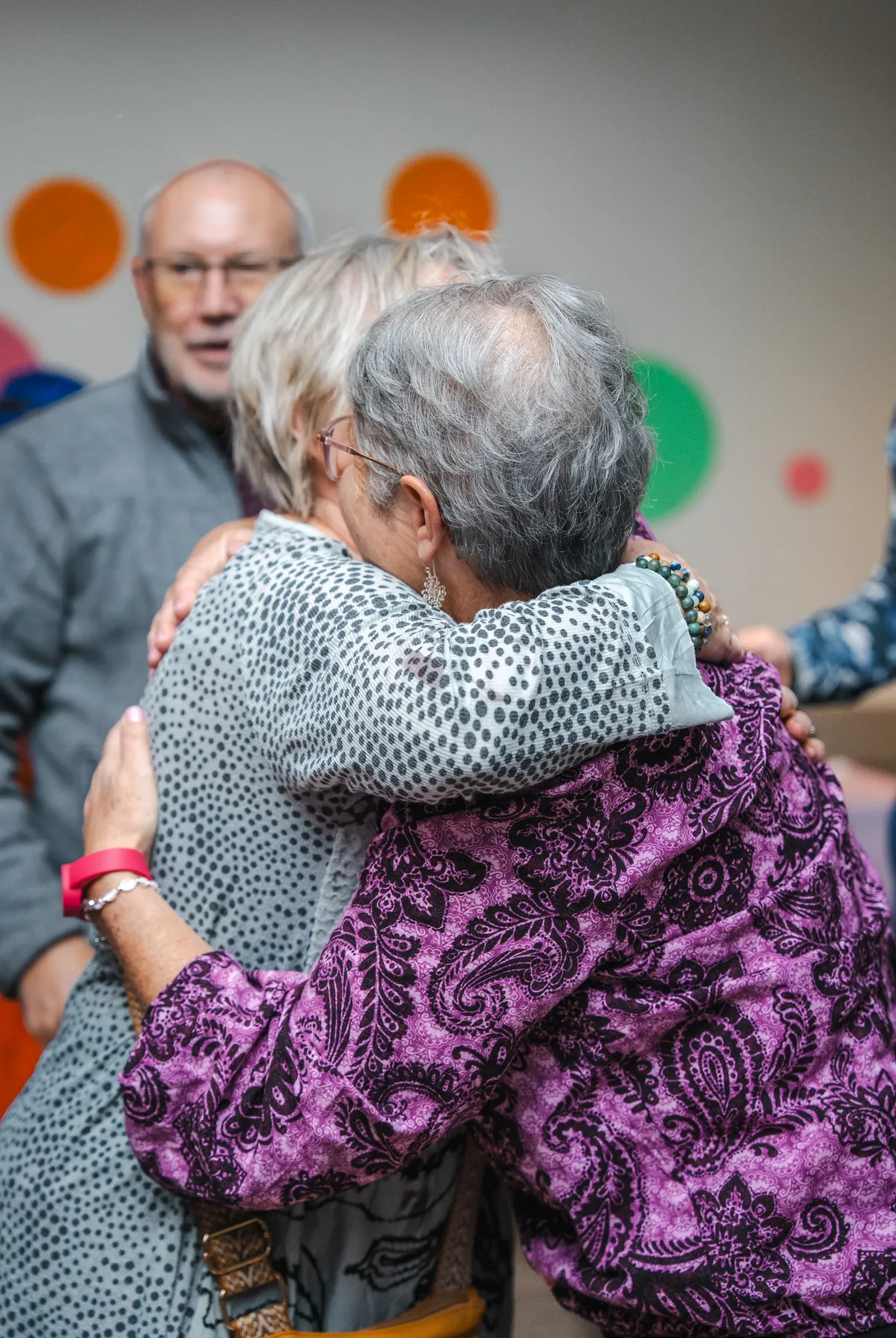 Guests sharing a hug at Alison’s birthday celebration.