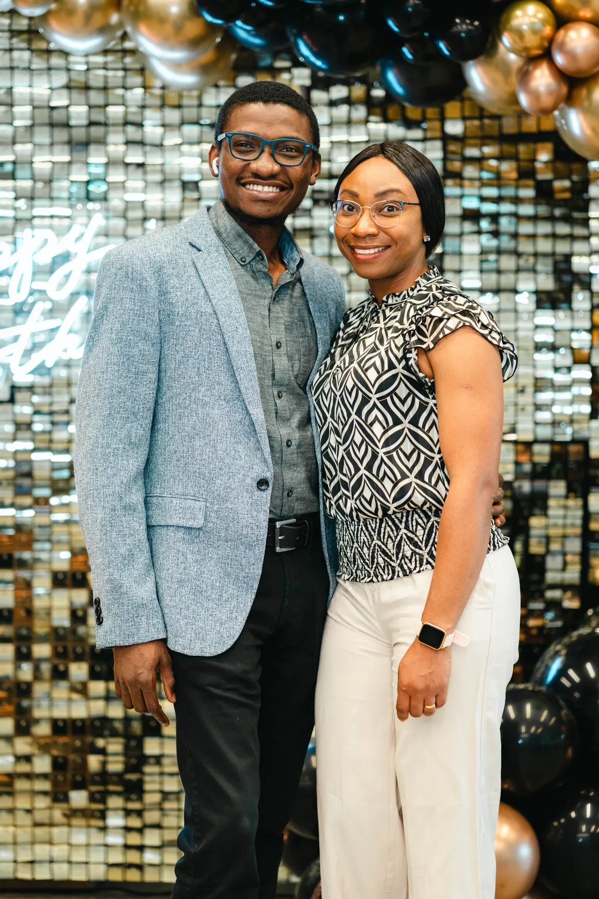 A couple posing together at BJ’s 40th birthday party.