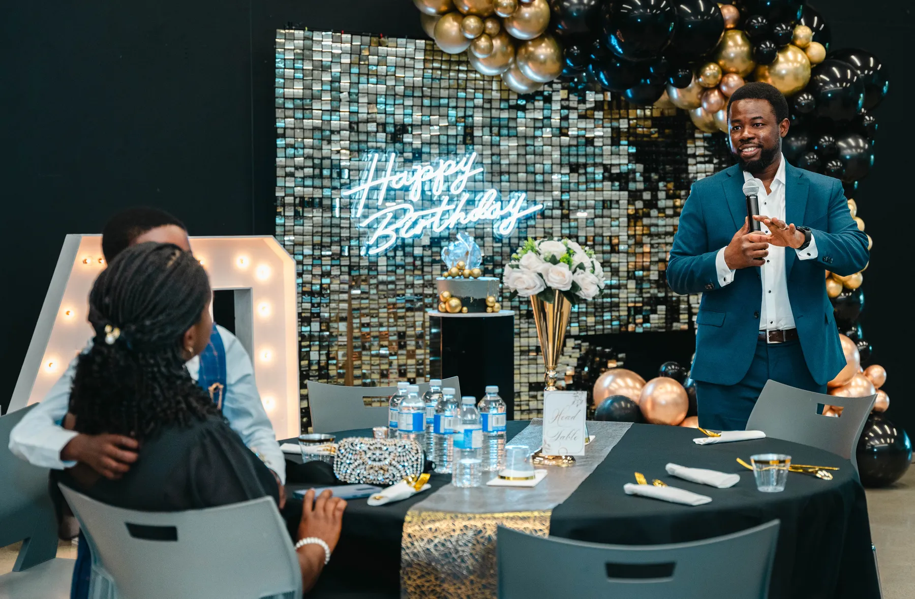 A man addressing the party guests at BJ’s 40th birthday party.