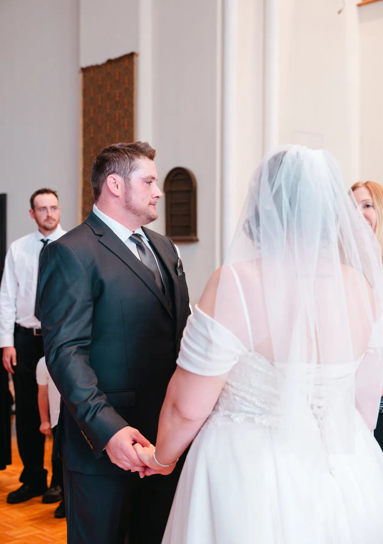 The couple and wedding party during the church ceremony at Kody and Jaz’s wedding.