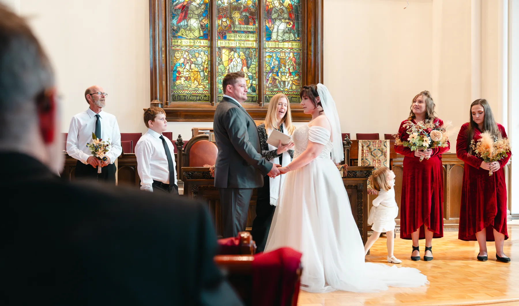 The couple and wedding party during the church ceremony at Kody and Jaz’s wedding.